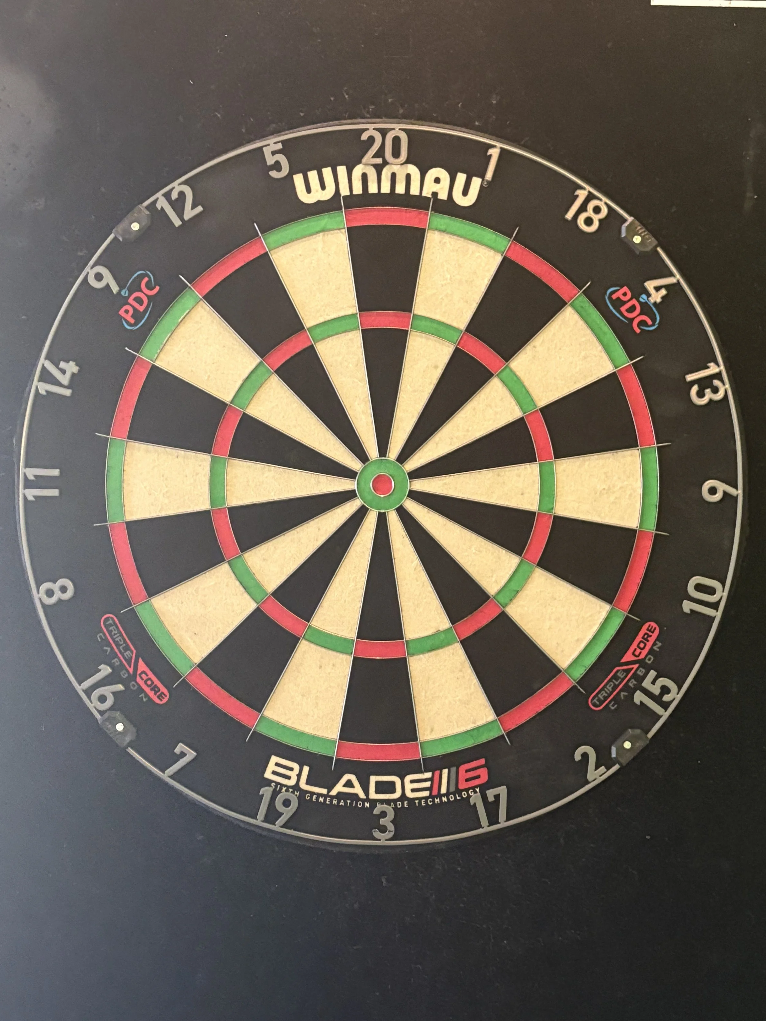 Play darts on professional dart boards at Chartreuse Saloon in Kansas City