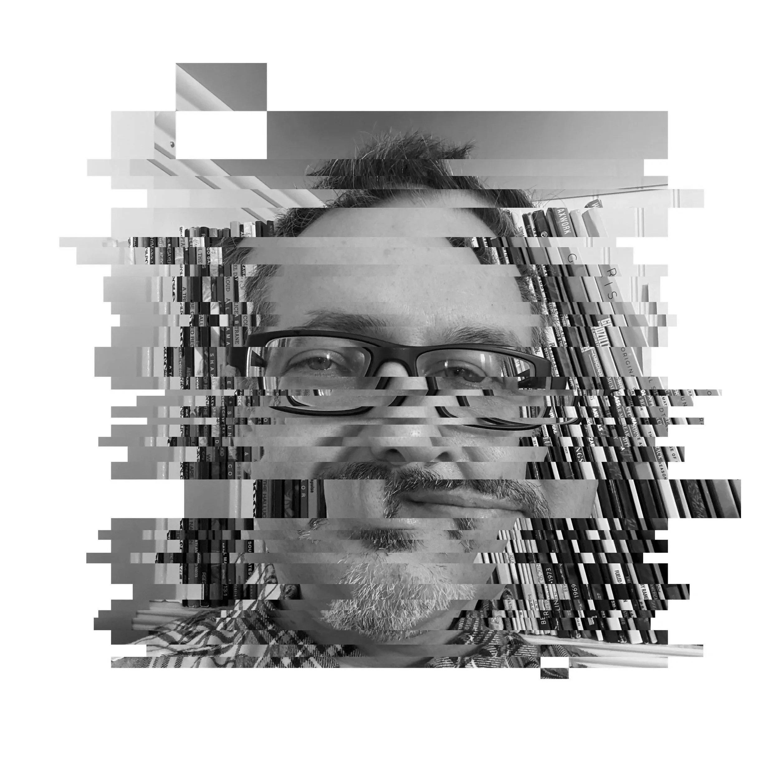 Black and white photo of a person's face wearing glasses, with hair and beard, surrounded by a background of books on shelves, with additional distorted horizontal pixelations.