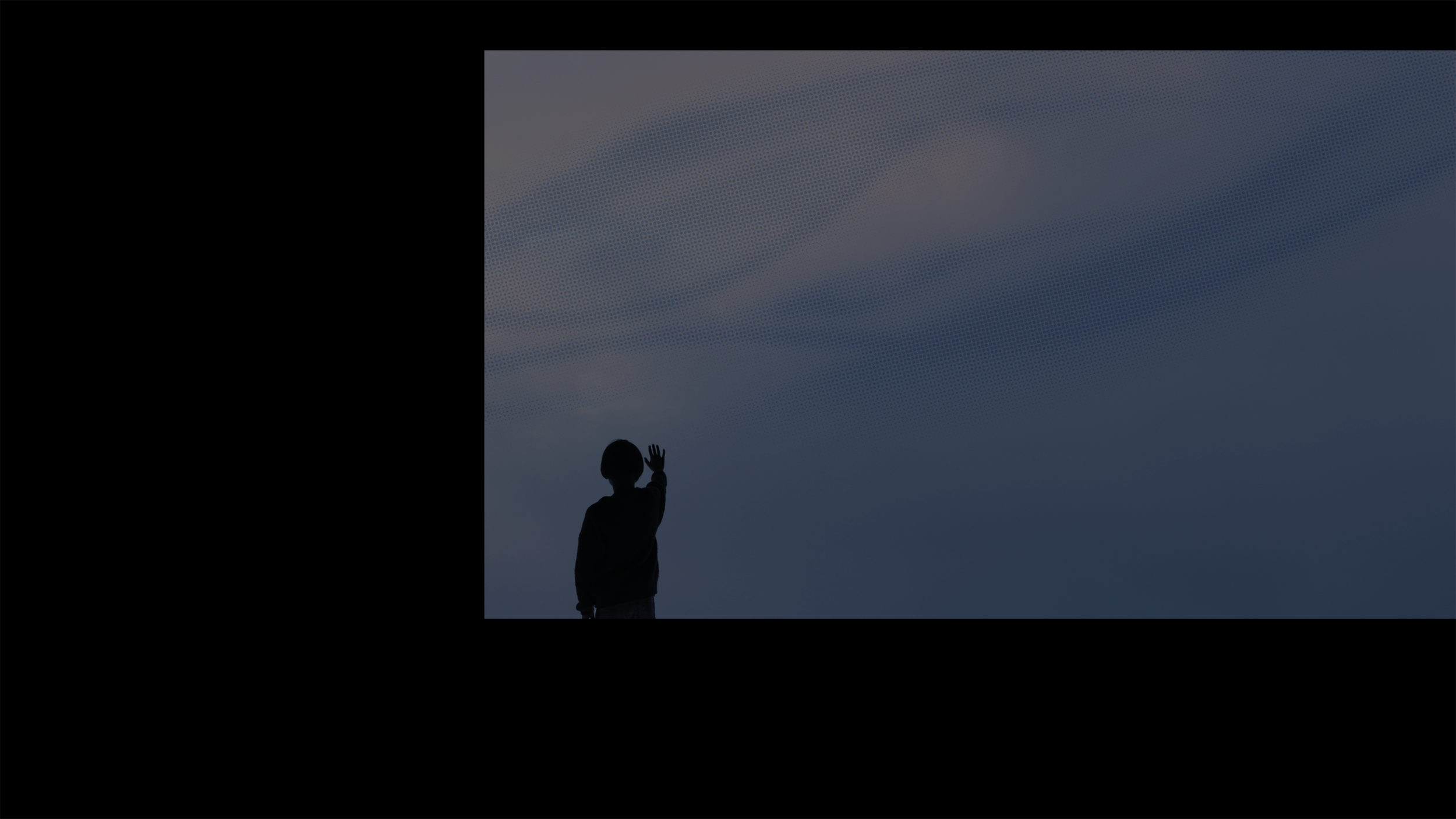 Silhouette of a child waving against a cloudy, blue sky.