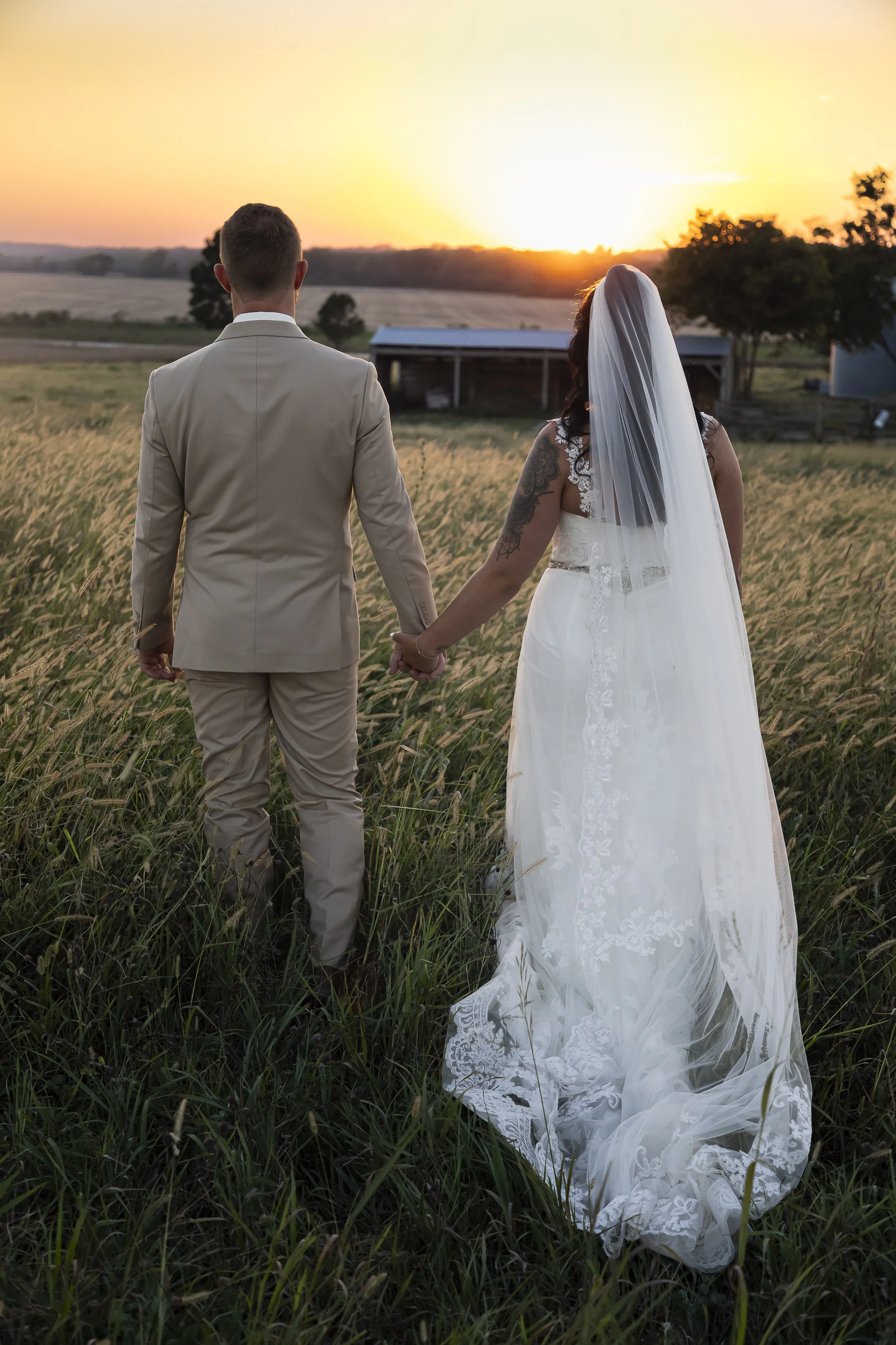 White Knot Barn Bride and Groom Sunset Picture.jpg