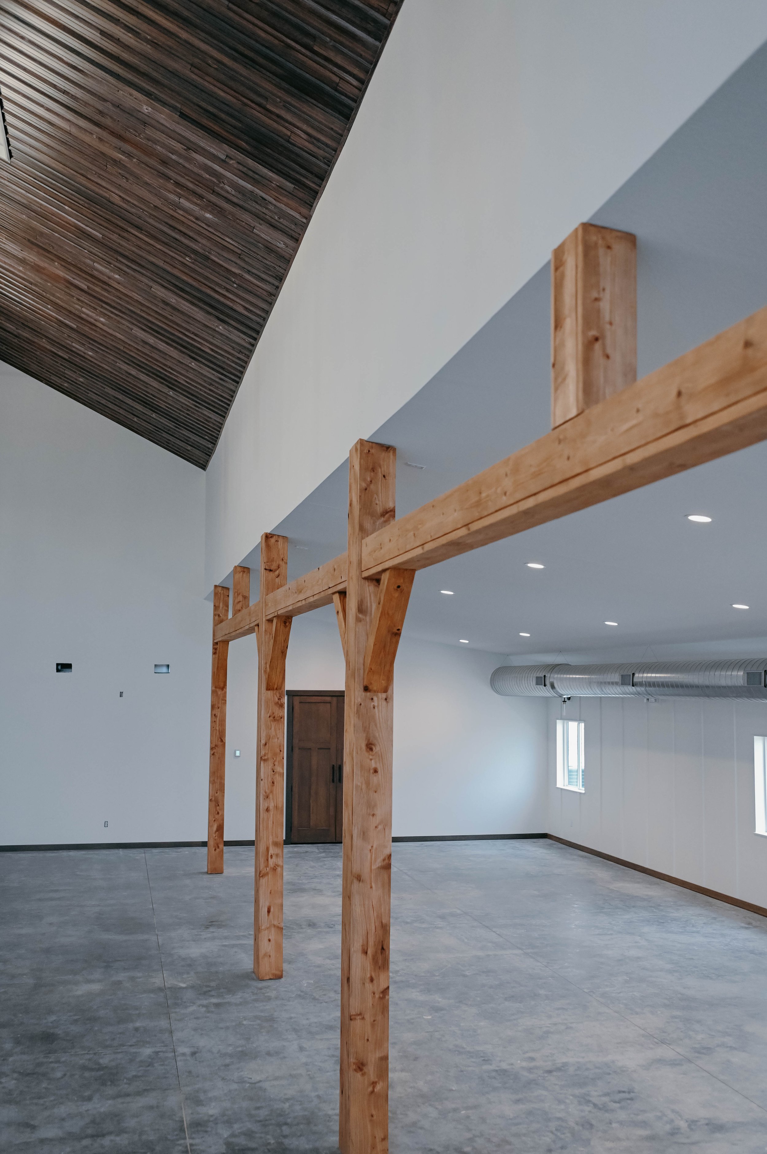 Large Wood Beams at White Knot Barn. Large open space to hold your dreamy Iowa Wedding.