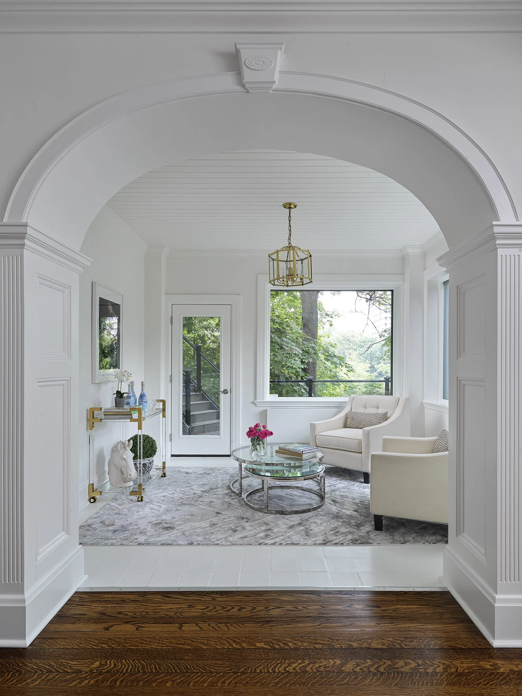 Stunning high end room with white walls and furniture in a Casa Loma home