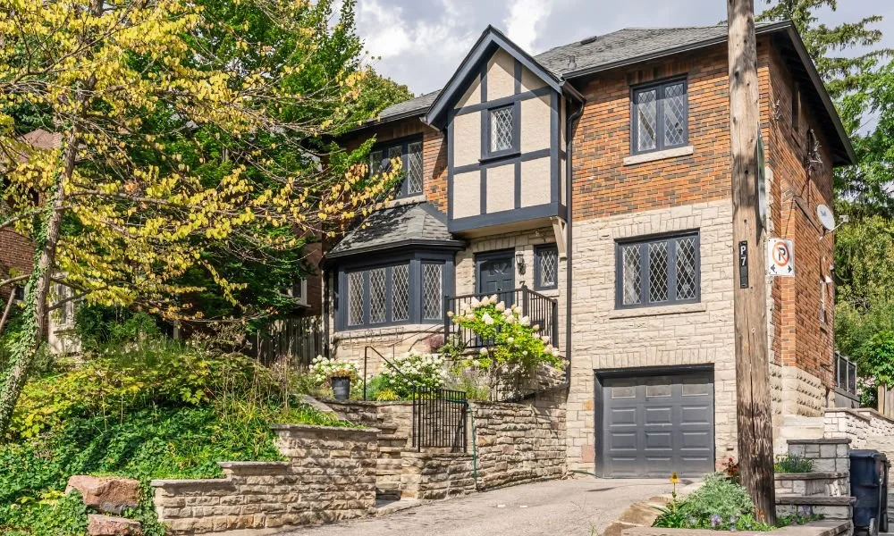 Front-facing steep gable, decorative half-timbering like most properties of this era
