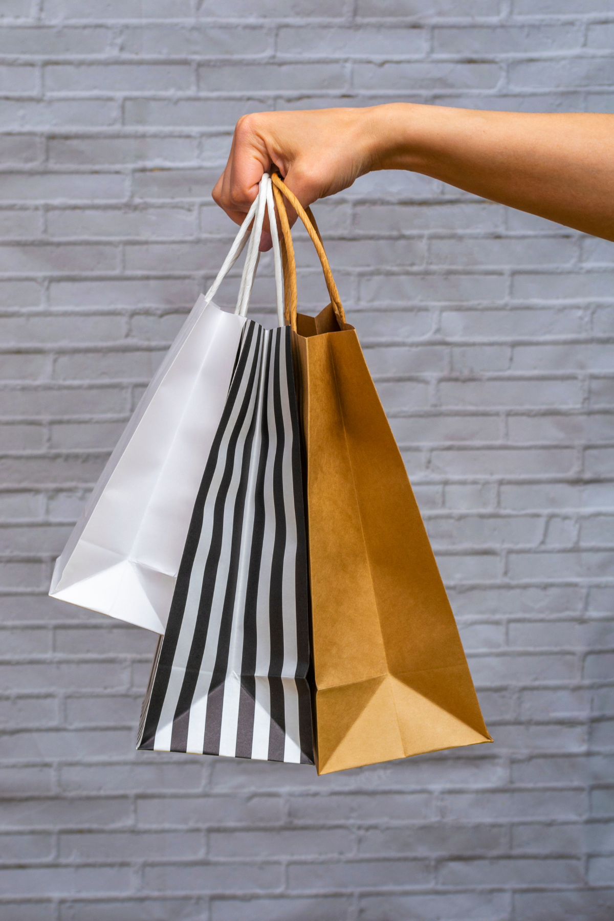 White, striped and brown shopping bags