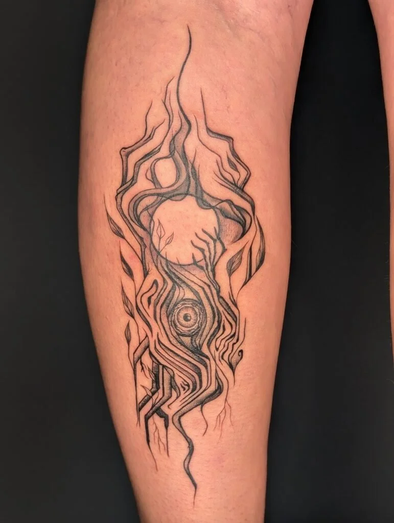 Line art tattoo of a stylized, abstract flame with a spiral eye in the center, featuring flowing, wavy lines and leaf-like shapes.