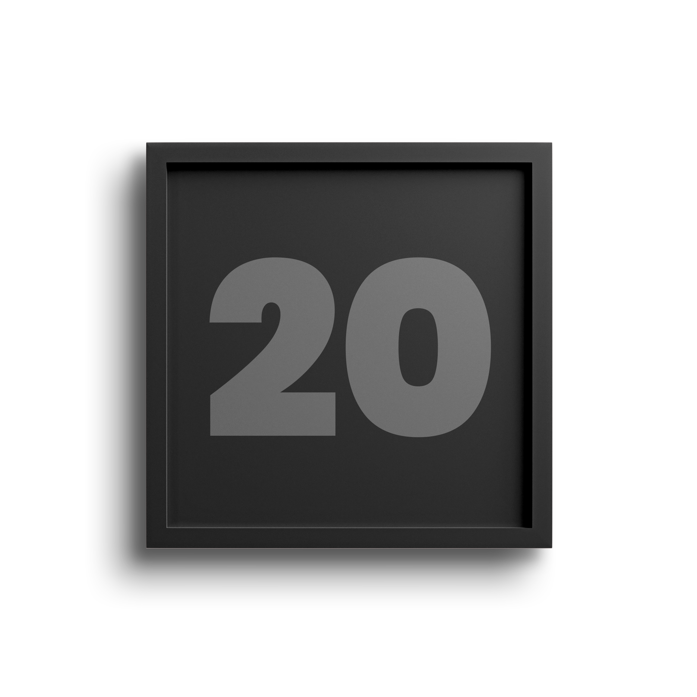 Close-up of a black digital clock displaying the number 20 in gray on a dark background, with a partially visible pinkish wall behind it.