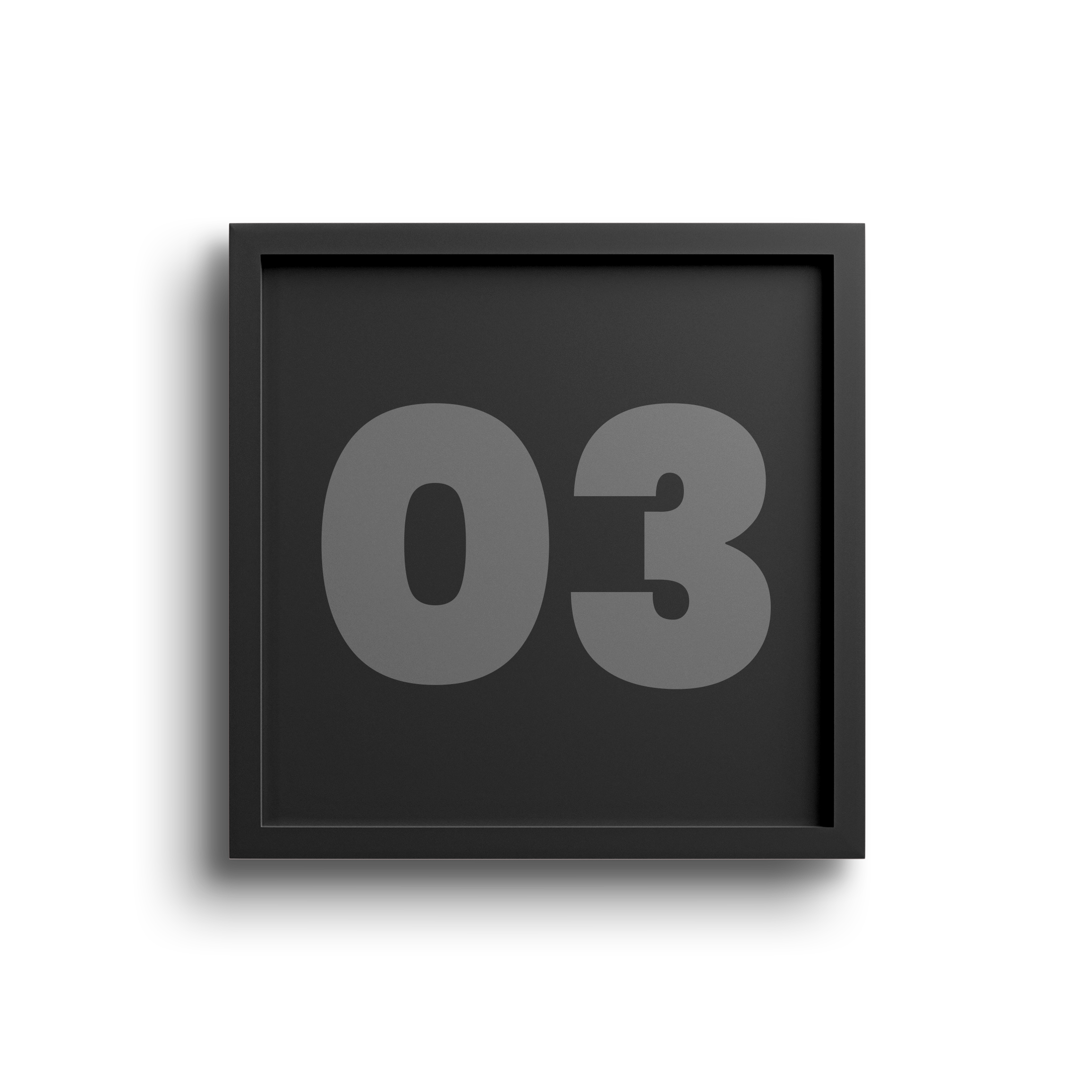 Black digital clock displaying the number 03 with a gray background and a beige wall on the right side.