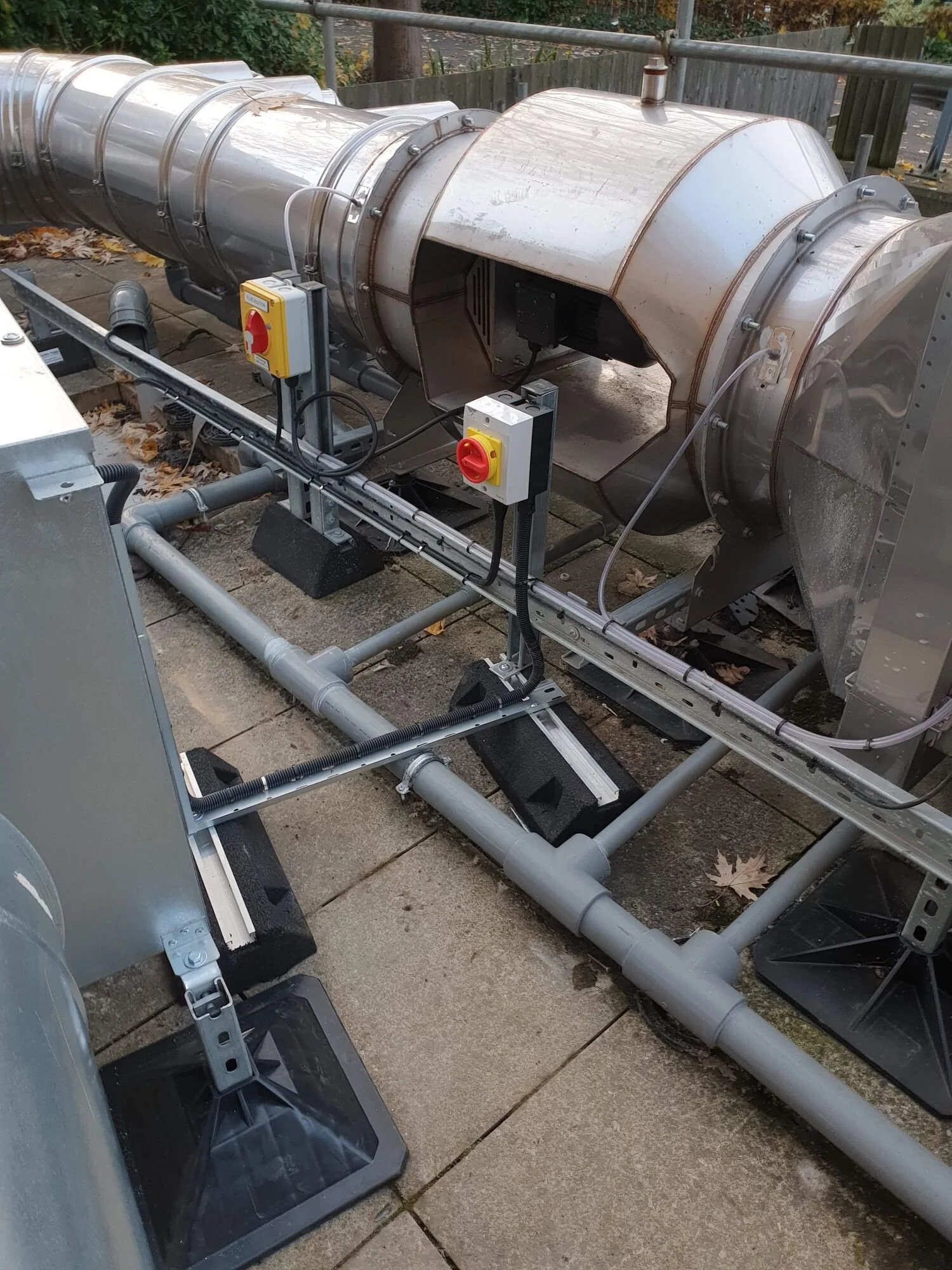 Galvanised conduit and isolators for rooftop fans