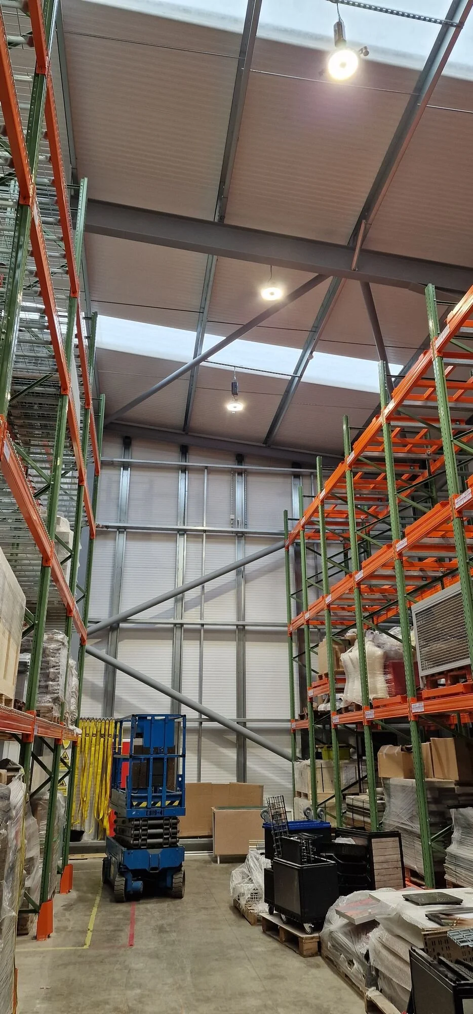 Warehouse racking lit by round LED high bays, Kibworth