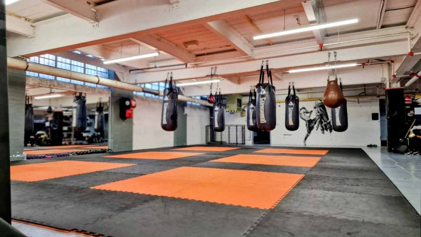 LED batten lighting over the training floor of a boxing gym after a fluorescent to LED upgrade, Leicester