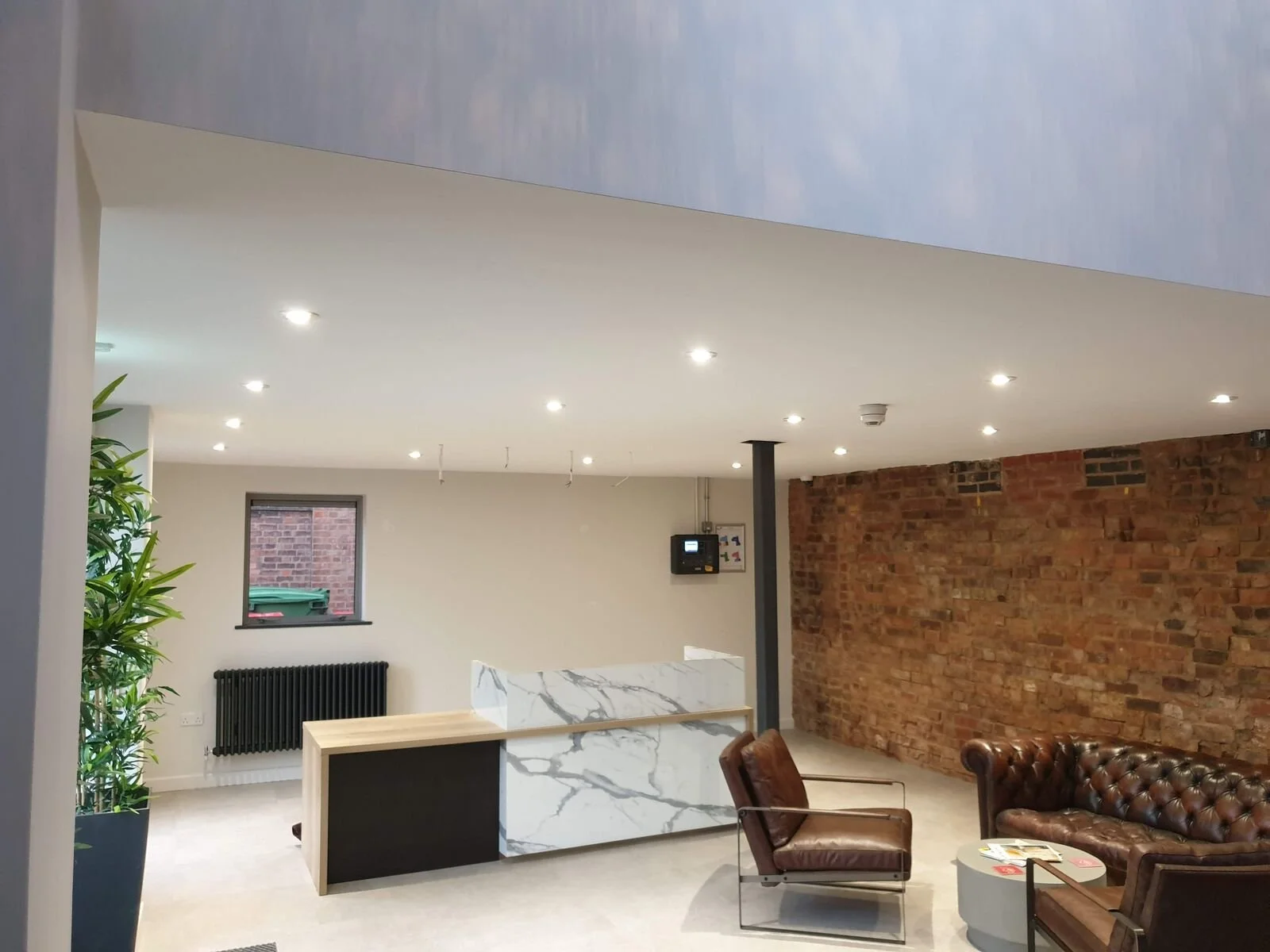 Office reception lit by recessed LED downlights