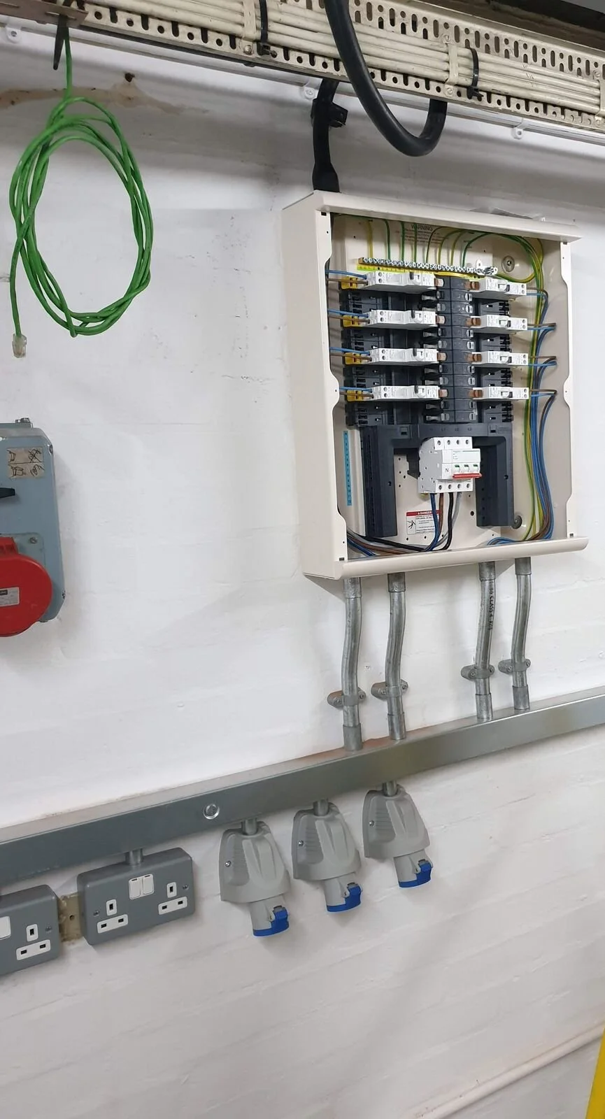Three-phase industrial sockets and a distribution board fed from steel trunking