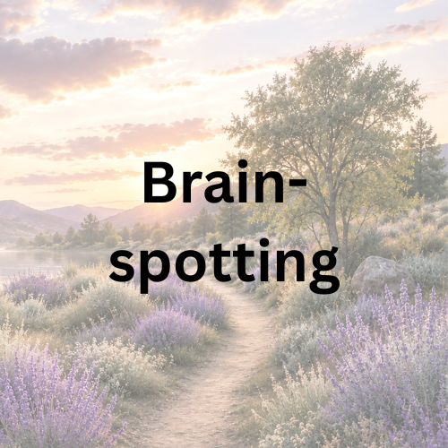 A room with a Brainspotting sign, cozy sofa and laptop