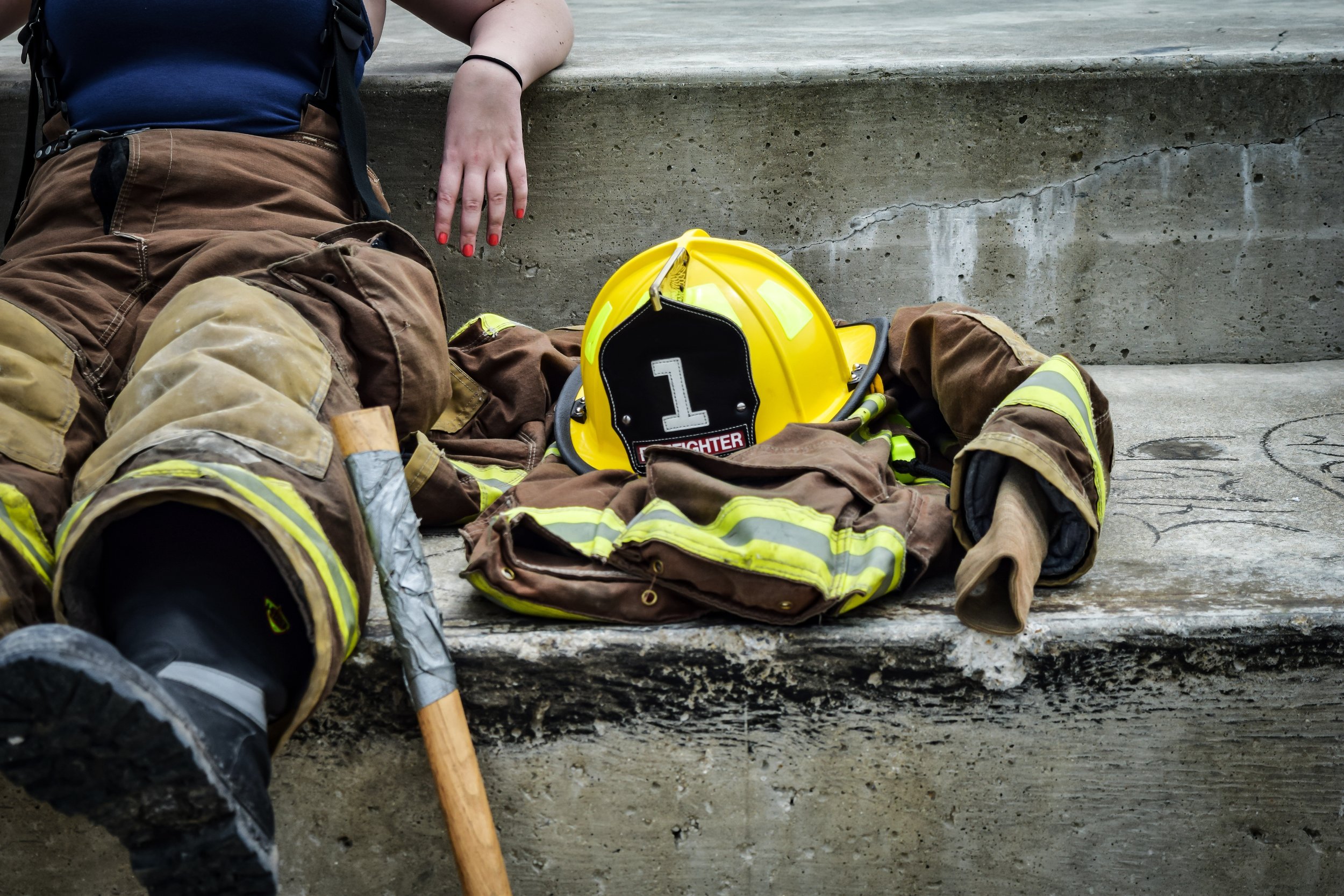 firefighter sitting by gear