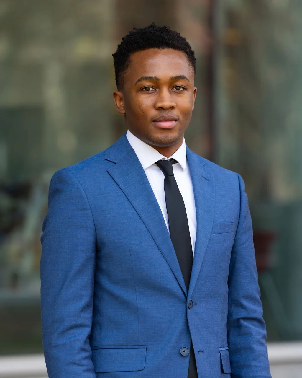 photo of Charles Sakouvogui in a blue suit