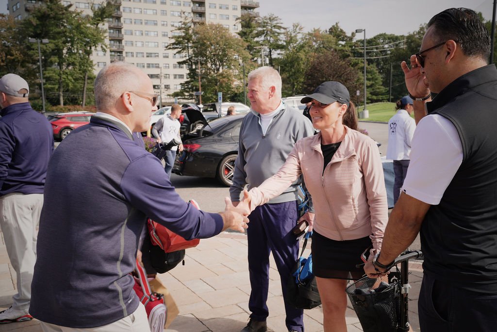check in crod handshake.jpeg