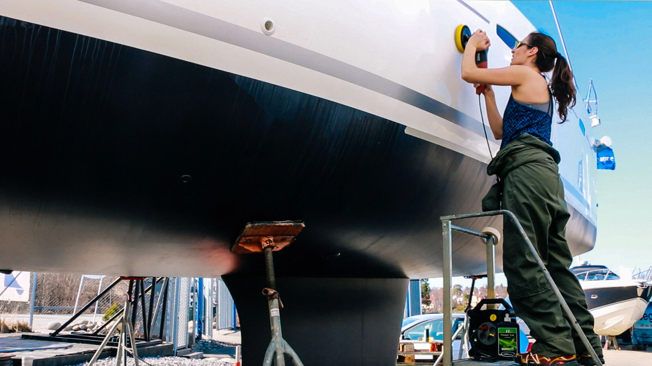 Sophie waxed the boat (almost) on her own.