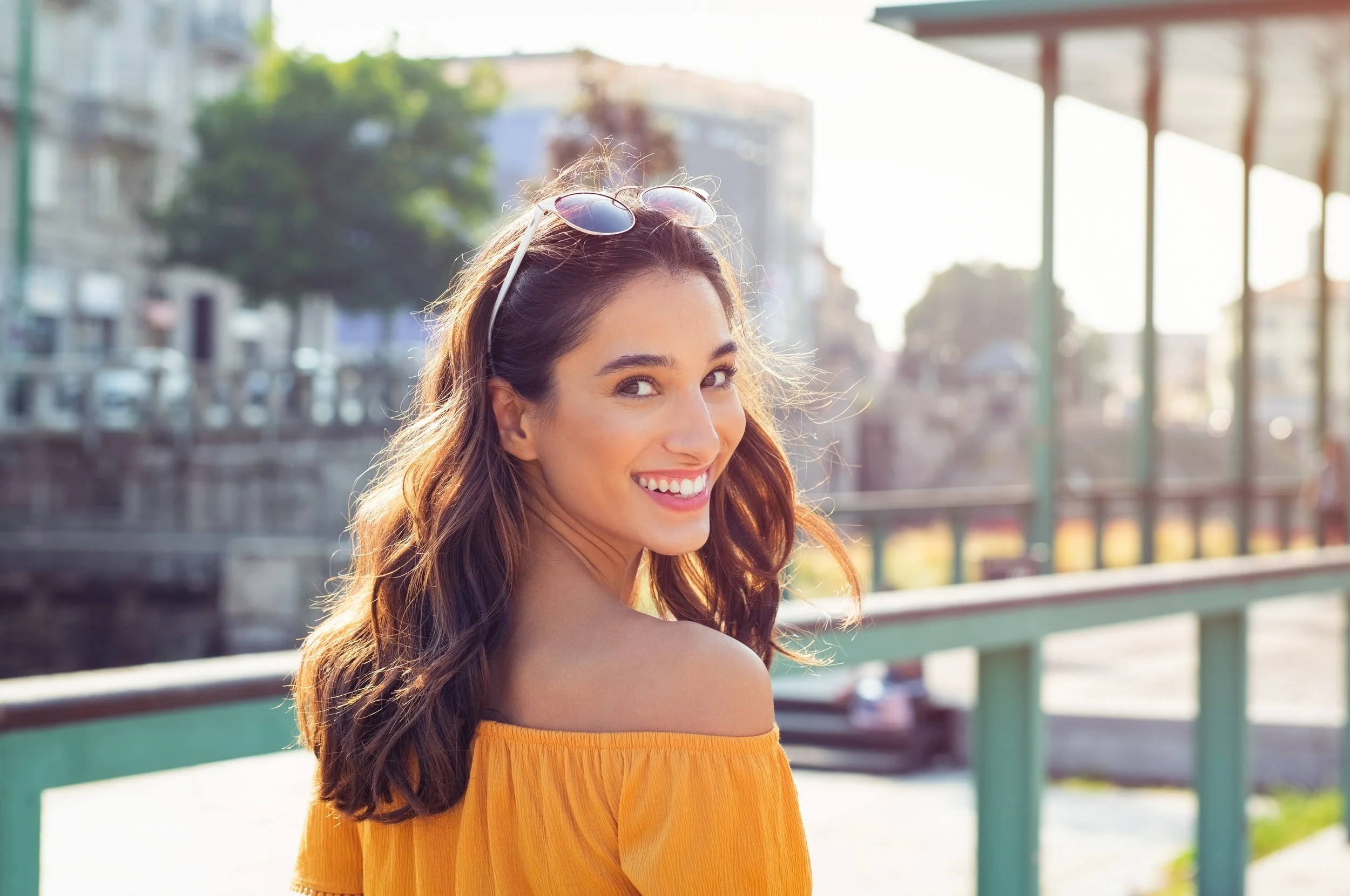 woman smiling while exploring city after ADHD therapy