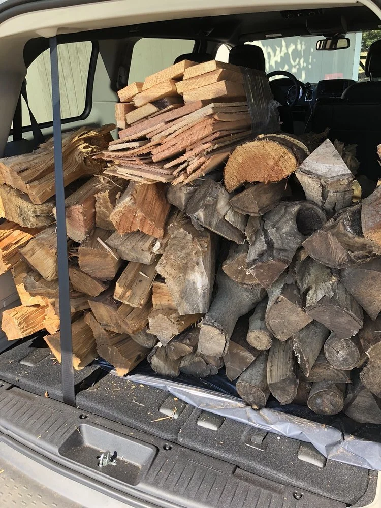 Pickup of cordwood in SUV from Windsor