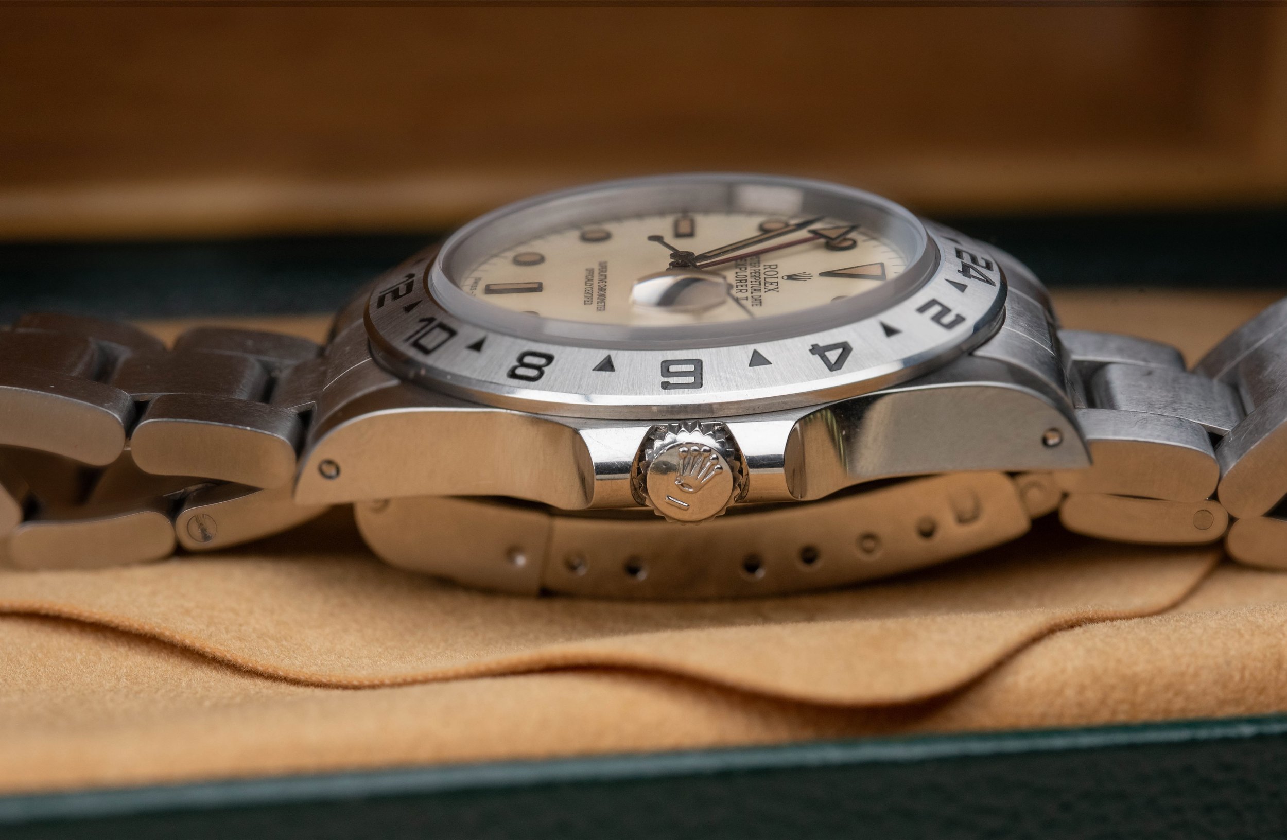 rolex 16550 crown and case flank showing bezel creamy dial and hand stack