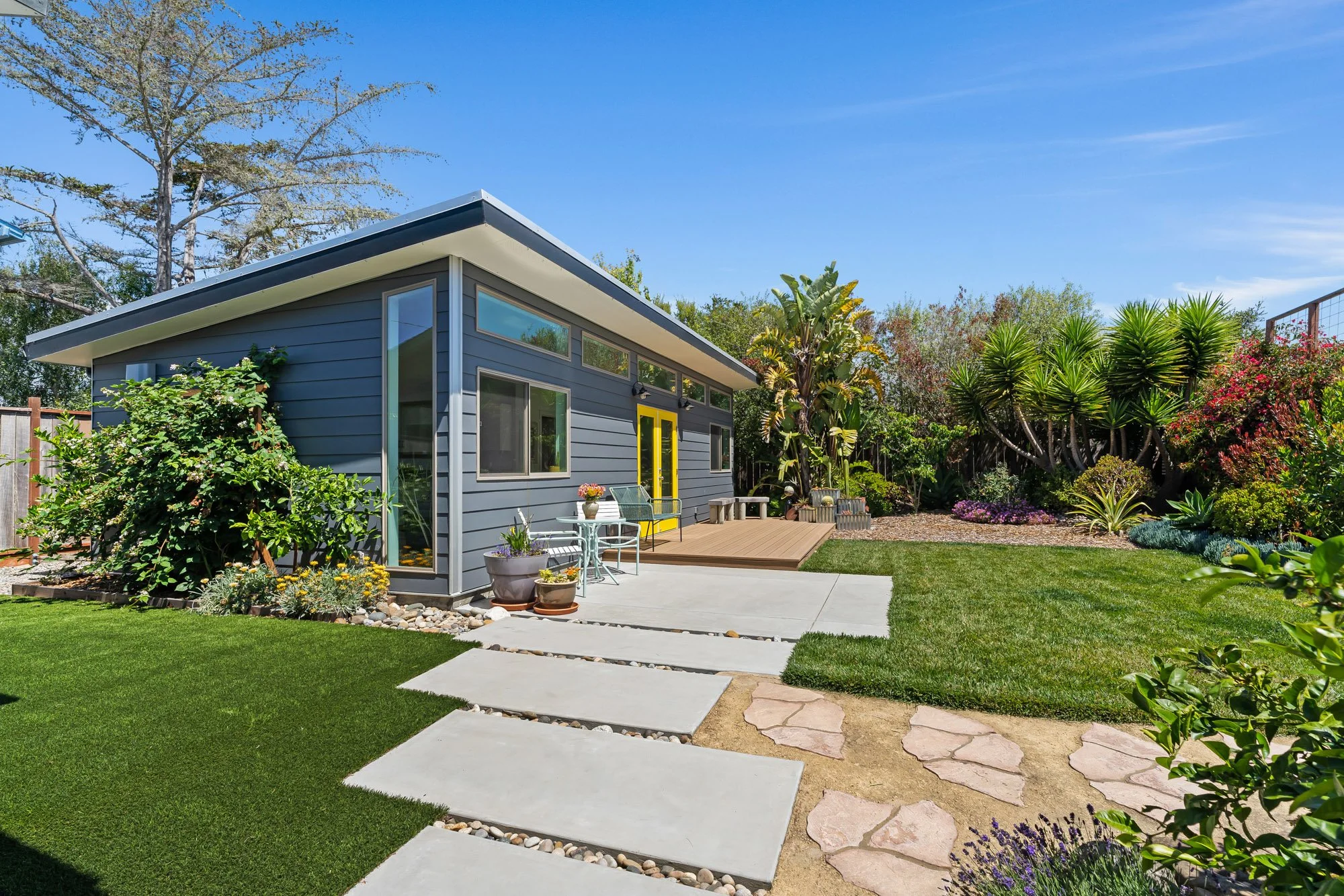 Modern detached ADU with landscaped backyard, private patio, and outdoor living space in Santa Cruz County.