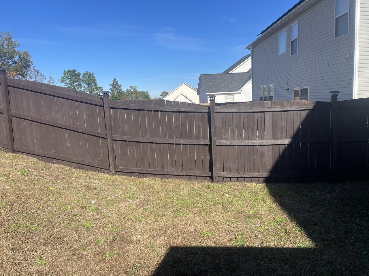 Fence staining and sealing