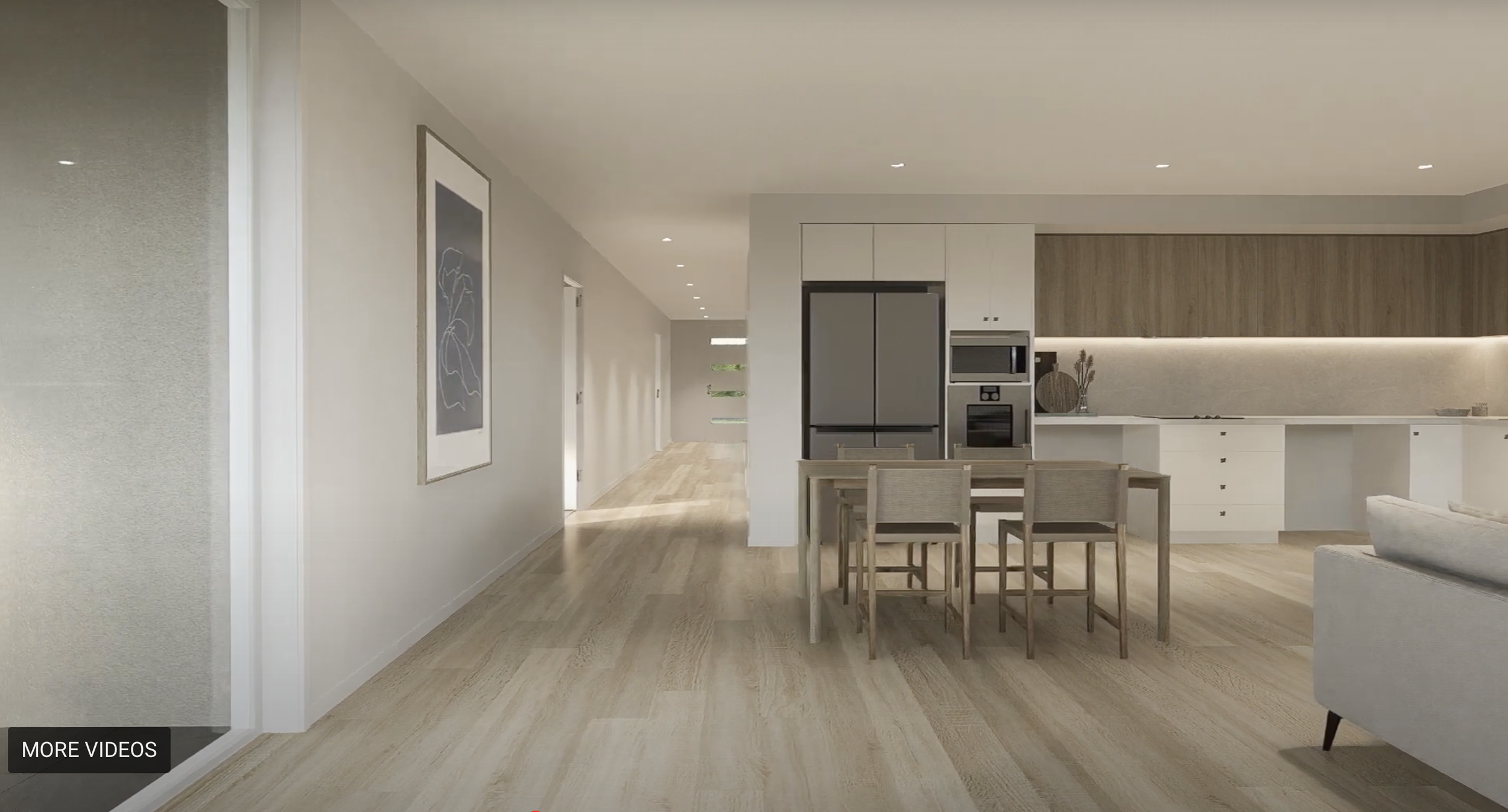Open-concept kitchen and dining area with light wood flooring, white cabinets, stainless steel refrigerator and microwave, beige wall art, and natural light streaming through the windows.