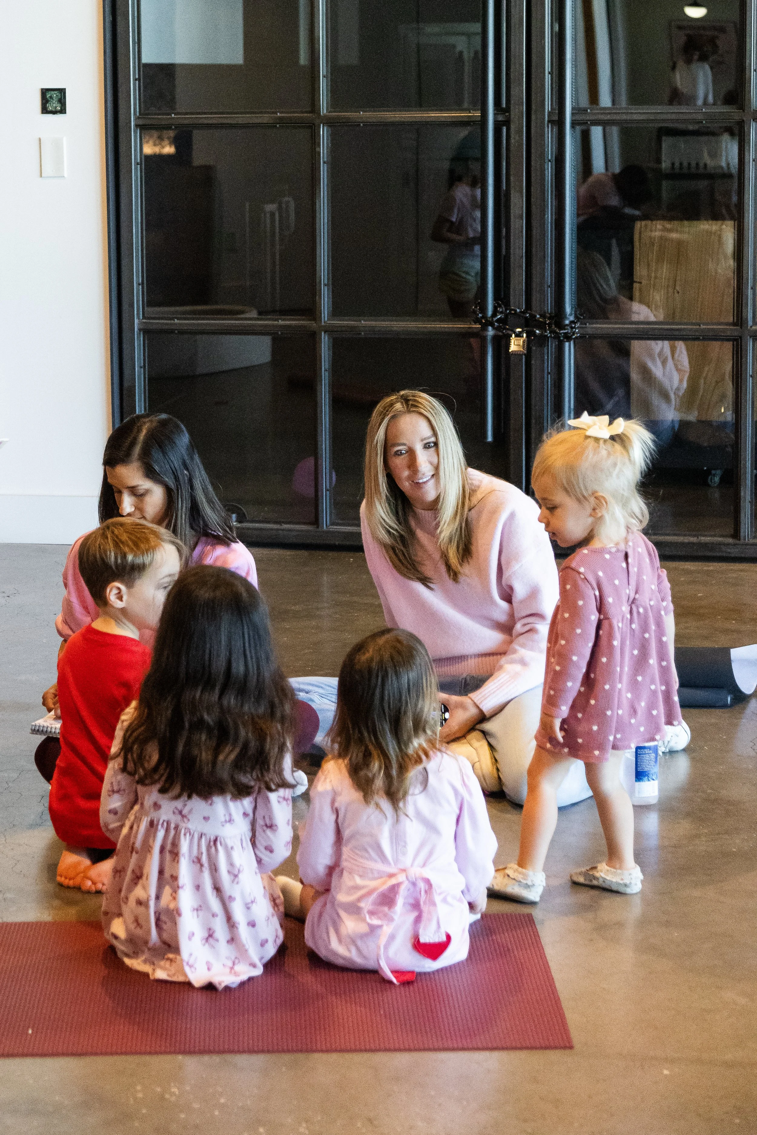 Community families connecting at Tampa kids yoga event.