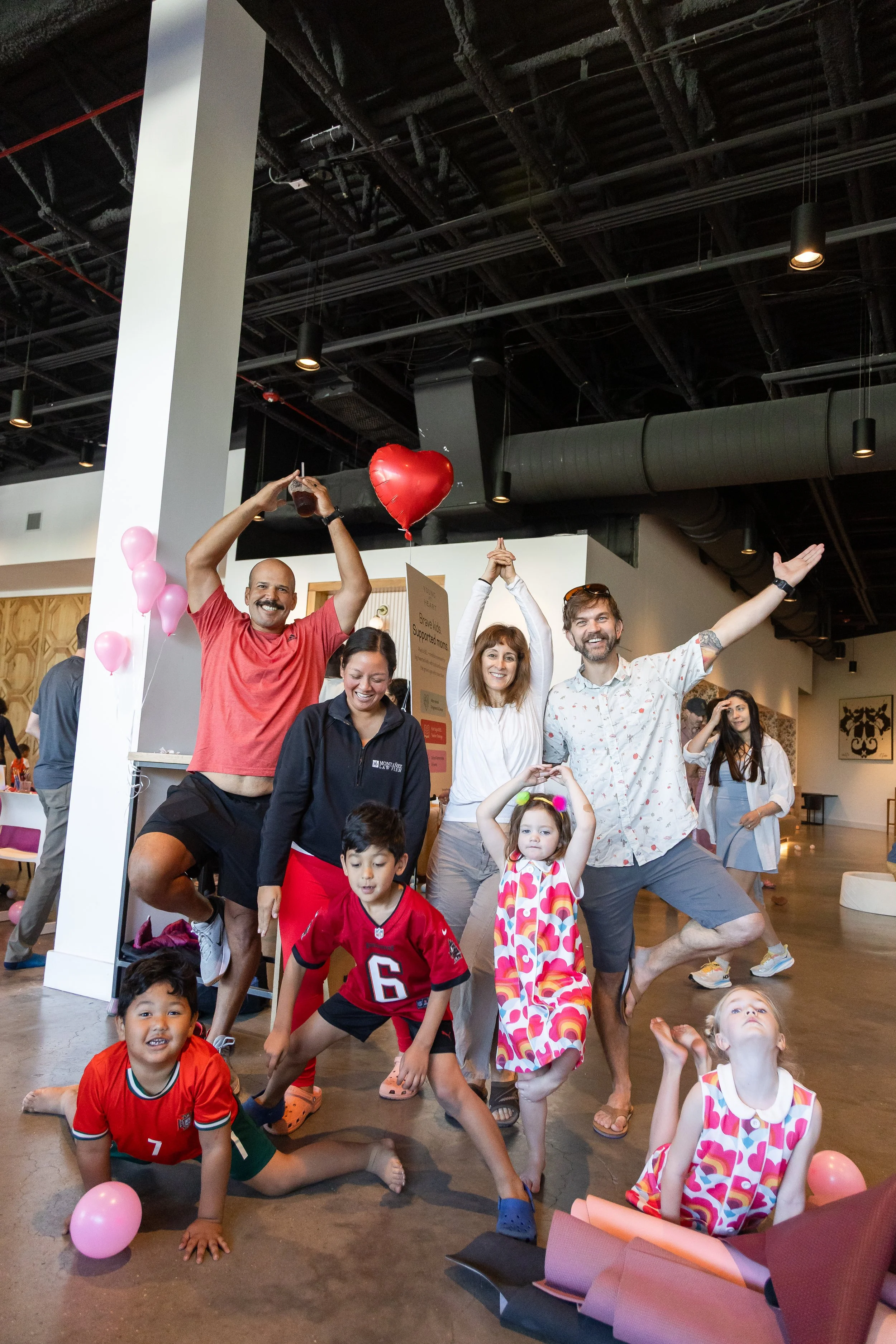 Community families connecting at Tampa kids yoga event.