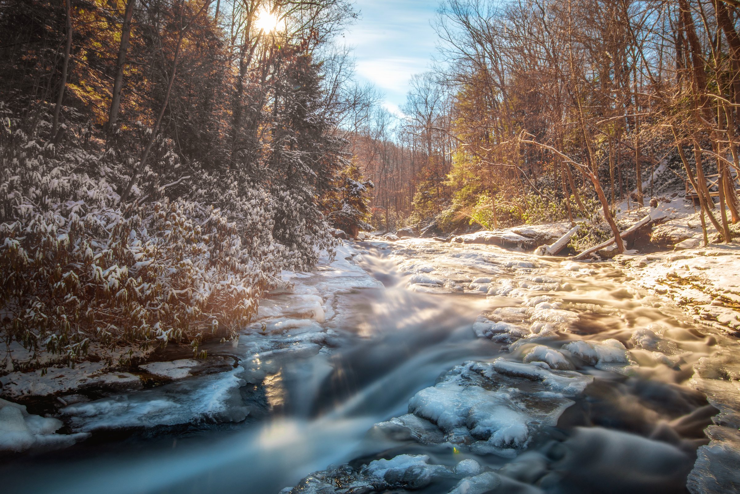 long exposure of the upper natural rock slides ohiopyle state park winter snow.jpg