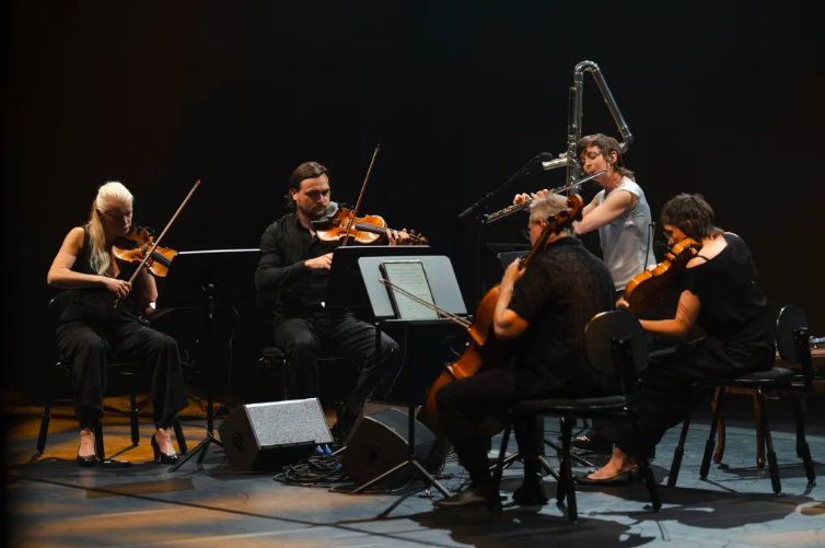 "Given in a dazzling rendition by Chase and the TMF Quartet, "The Holy Liftoff" marked a veritable apex of collaborative music-making, as the five musicians transformed the score realization into a lifetime journey of living sounds, beautifully inter