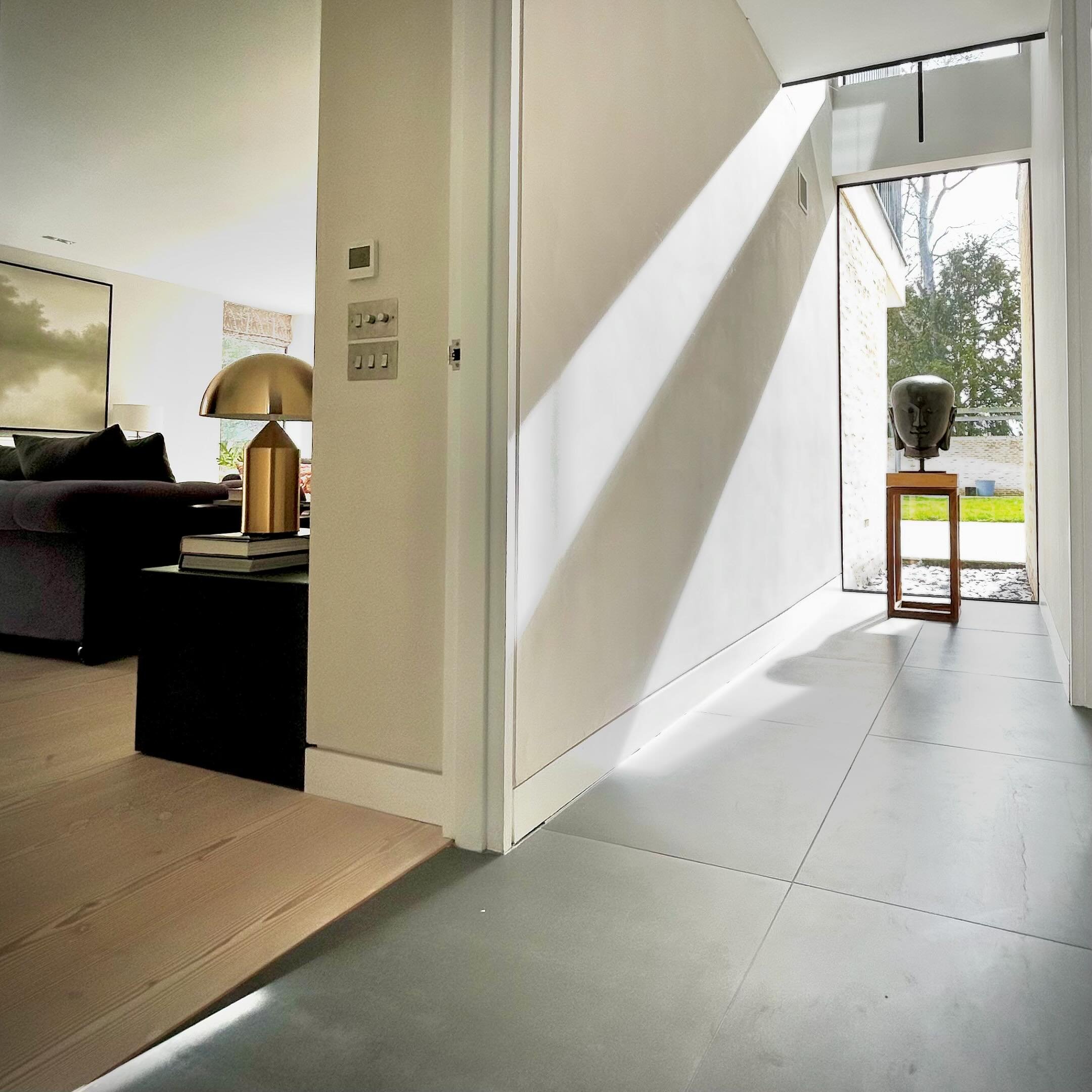 Zoning your space with flooring ~

Using different flooring materials is an effective way to delineate areas without closed off rooms. The ground floor of our house is mostly open plan so for practical reasons we used these dark, sleek porcelain tile