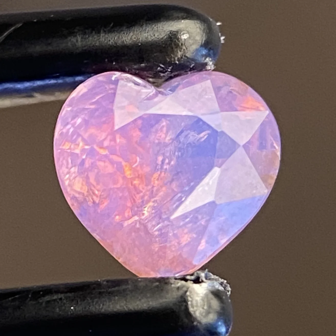 0.5 ct opalescent pink Tanzanian sapphire heart