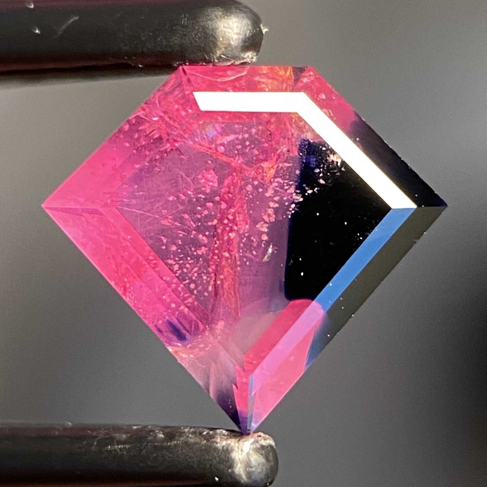 1.3 ct bicolor hot pink & dark blue Winza sapphire