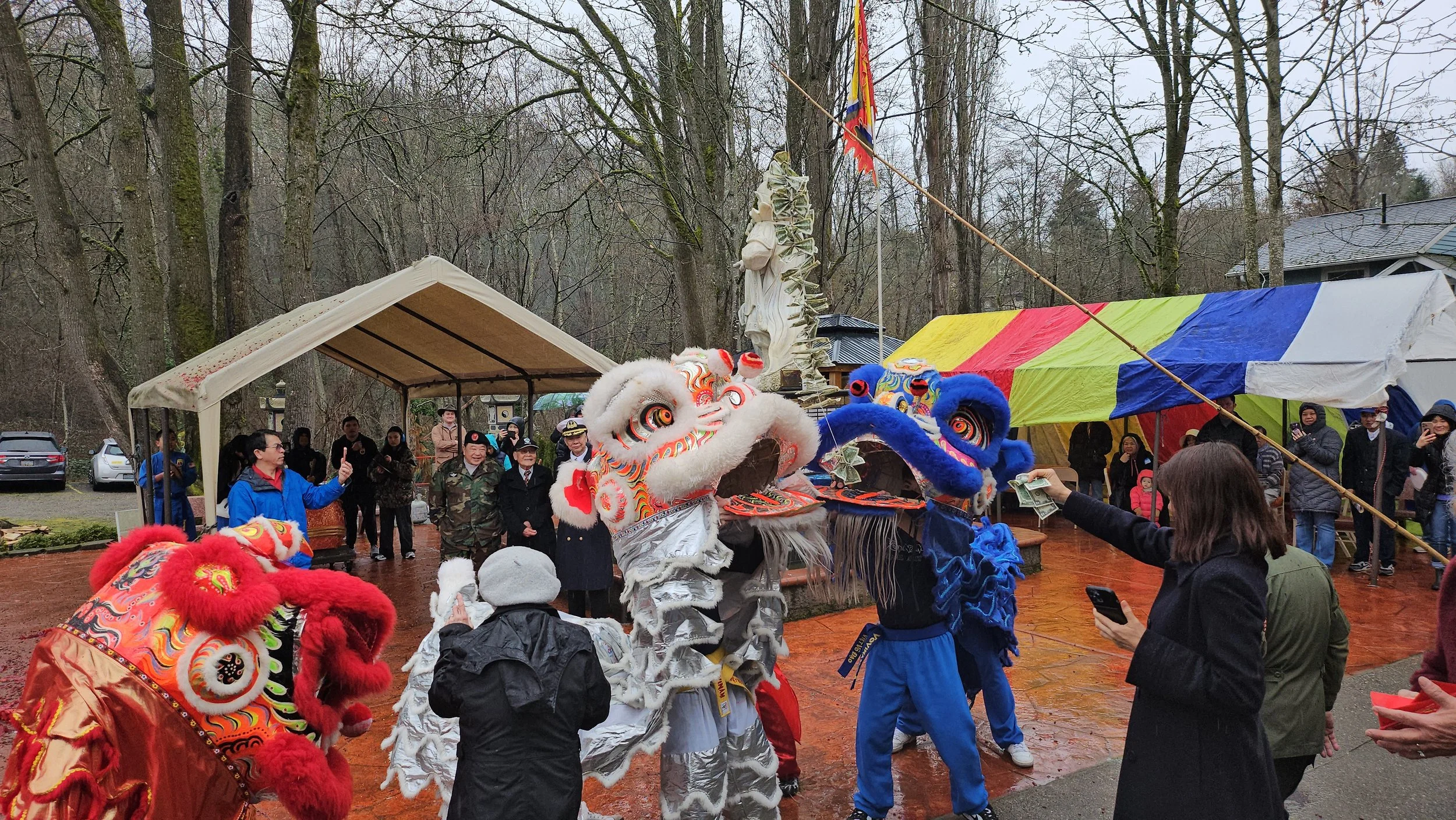 Tet 2026 Lion eating money string.jpg