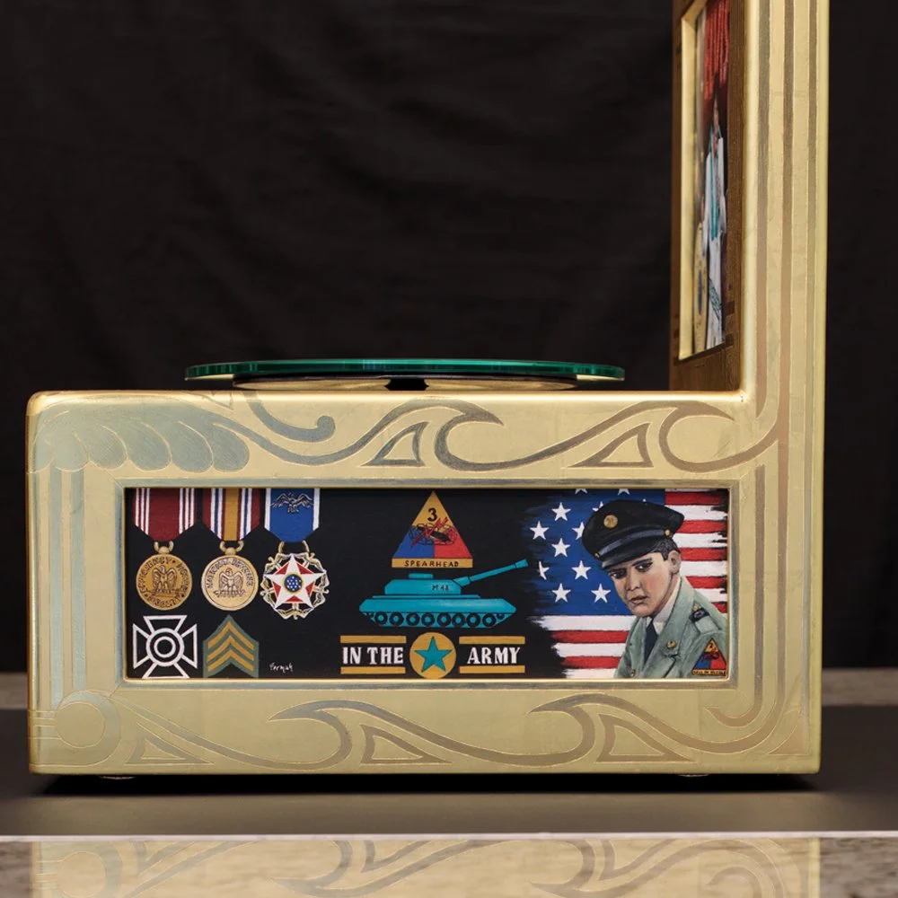 Despite his star status, Elvis enlisted in the army during the Vietnam war.  He earned several medals for his service, and they are depicted on this side panel.