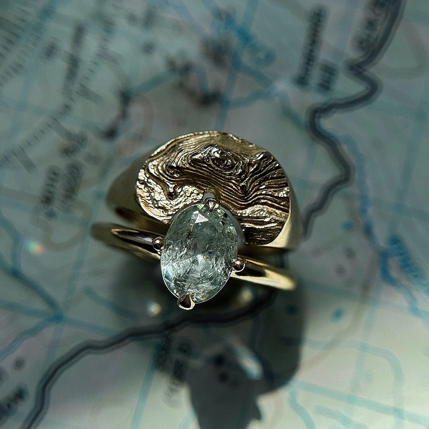 NEW CUSTOM TOPO WEDDING SET✨

This 14k yellow gold topographic engagement set takes us to one of my favorite spots along the NorCal Coast, Goat Rock Beach. My client chose to go with this light blue/green icy Montana Sapphire set in my Due North Comp