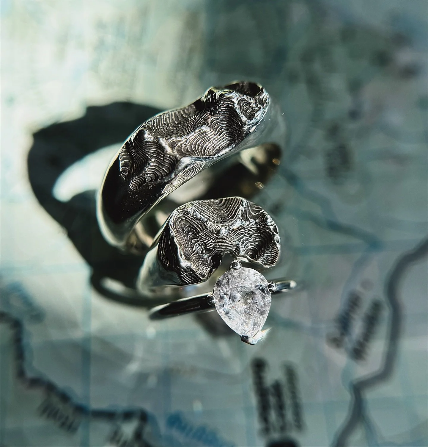 New Custom Topo Wedding Set🏔️

This topographic wedding set showcases 3 peaks along one ridge-line within the epic Glacier National Park.  The topo band highlights Longfellow Peak. The topo hug highlights Geduhn Peak. Both rings share Anaconda Peak,