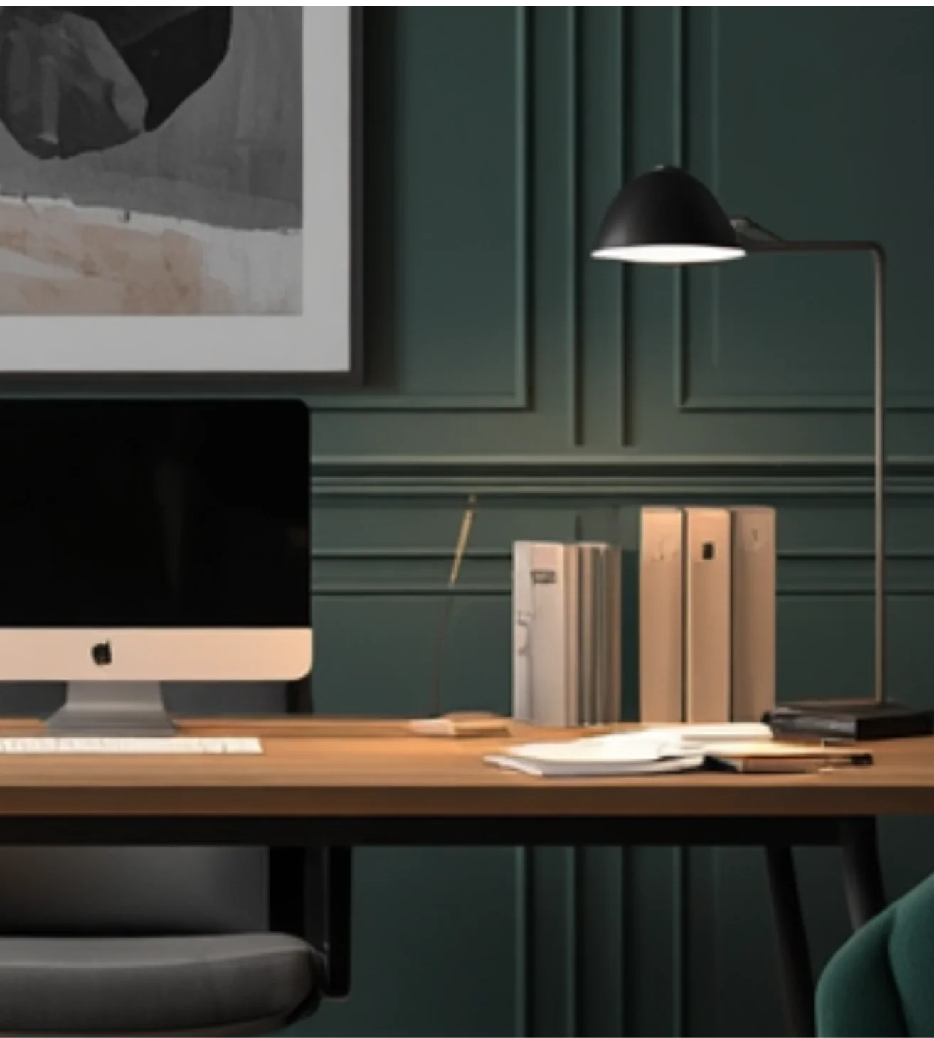 A modern workspace with a computer on a wooden desk, books on a shelf, and a black desk lamp. The background features teal paneled walls and a framed abstract artwork.