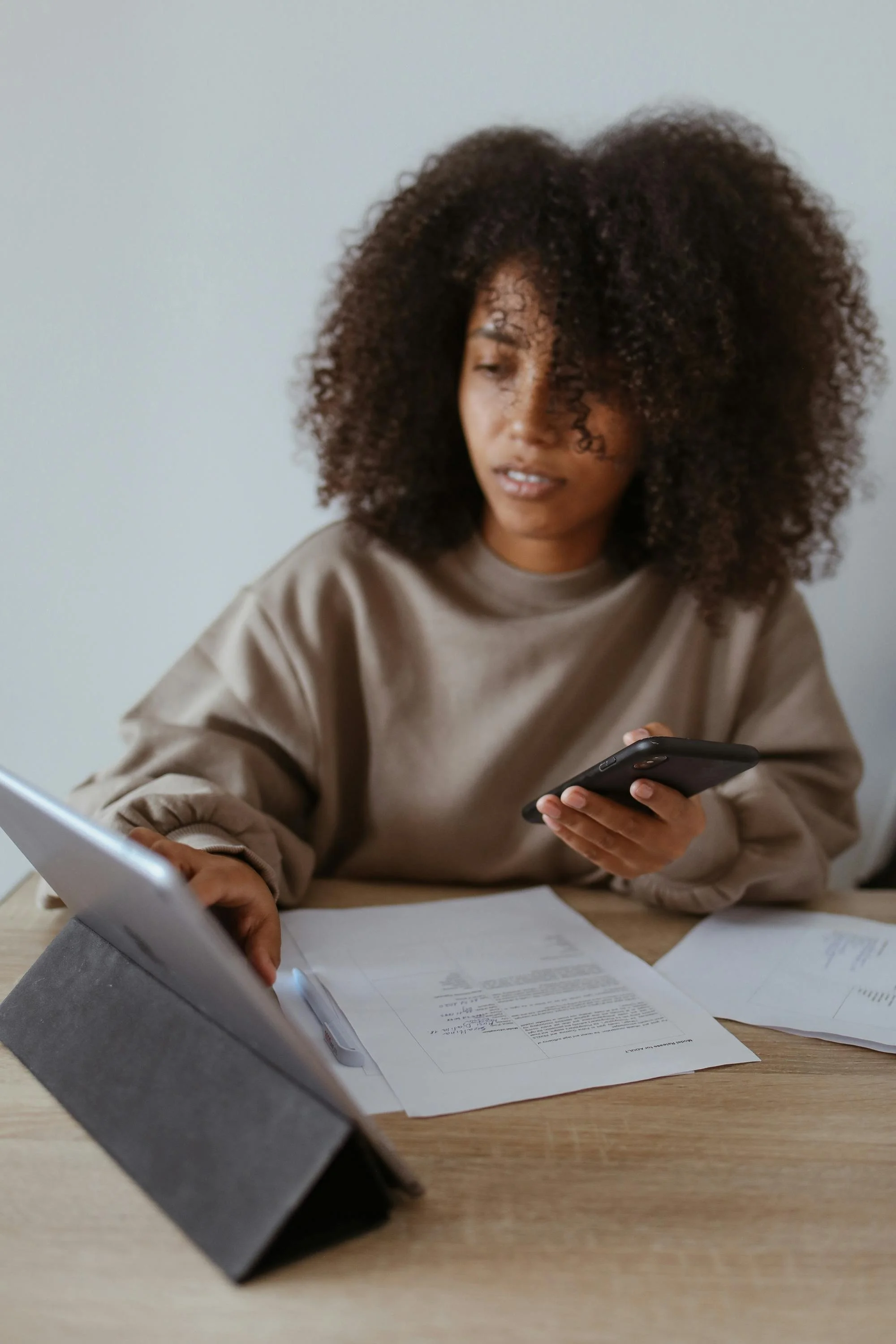 black women working on a digital tablet