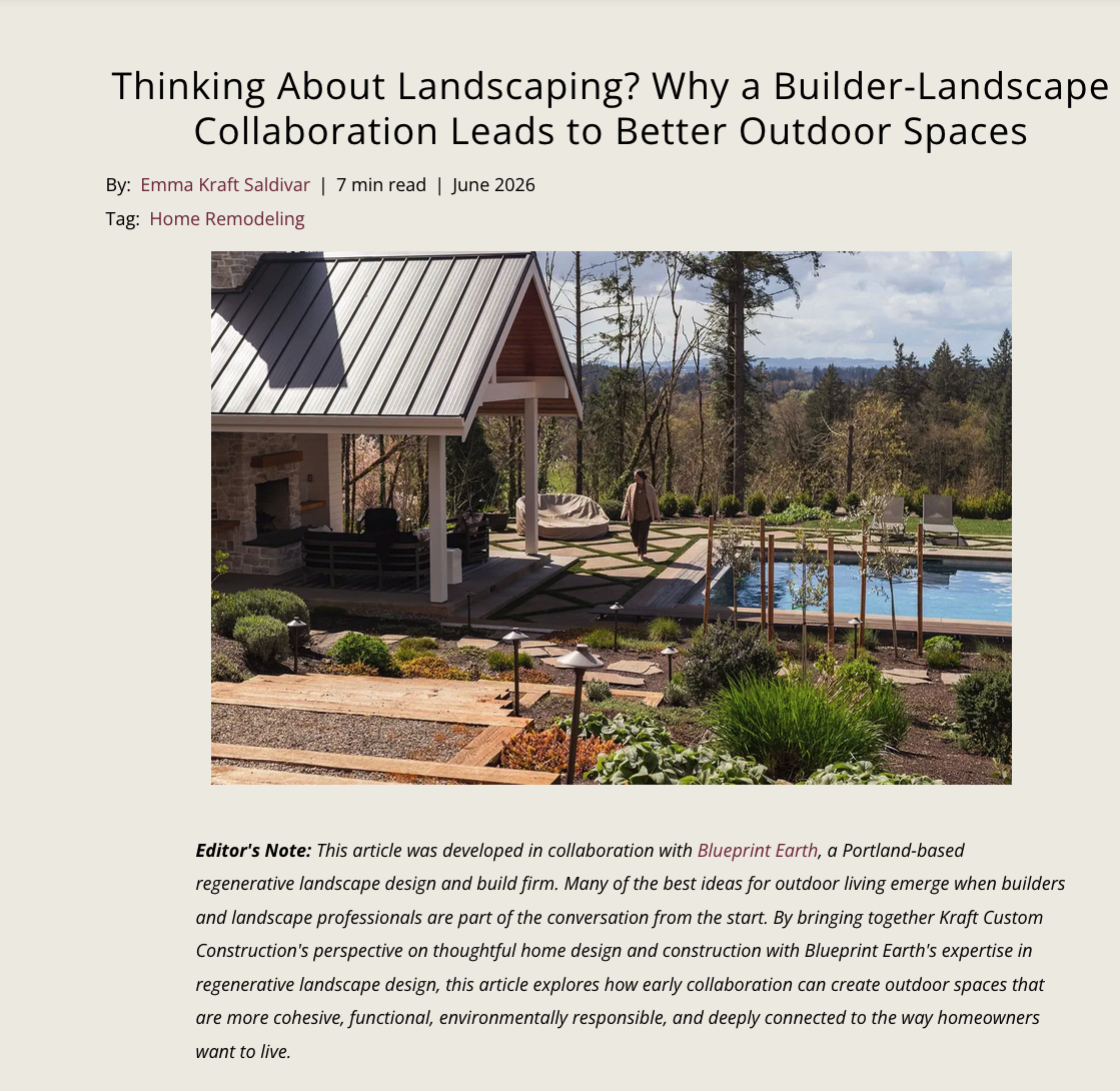 A landscaped backyard with a patio, hot tub, and garden, with trees and hills in the background.