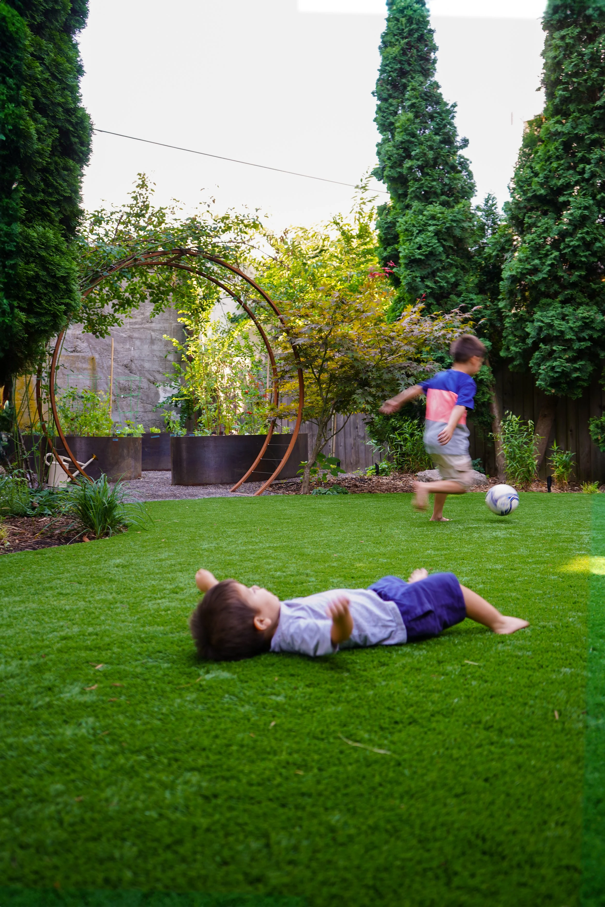 two kids playing outside in a new Blueprint Earth design