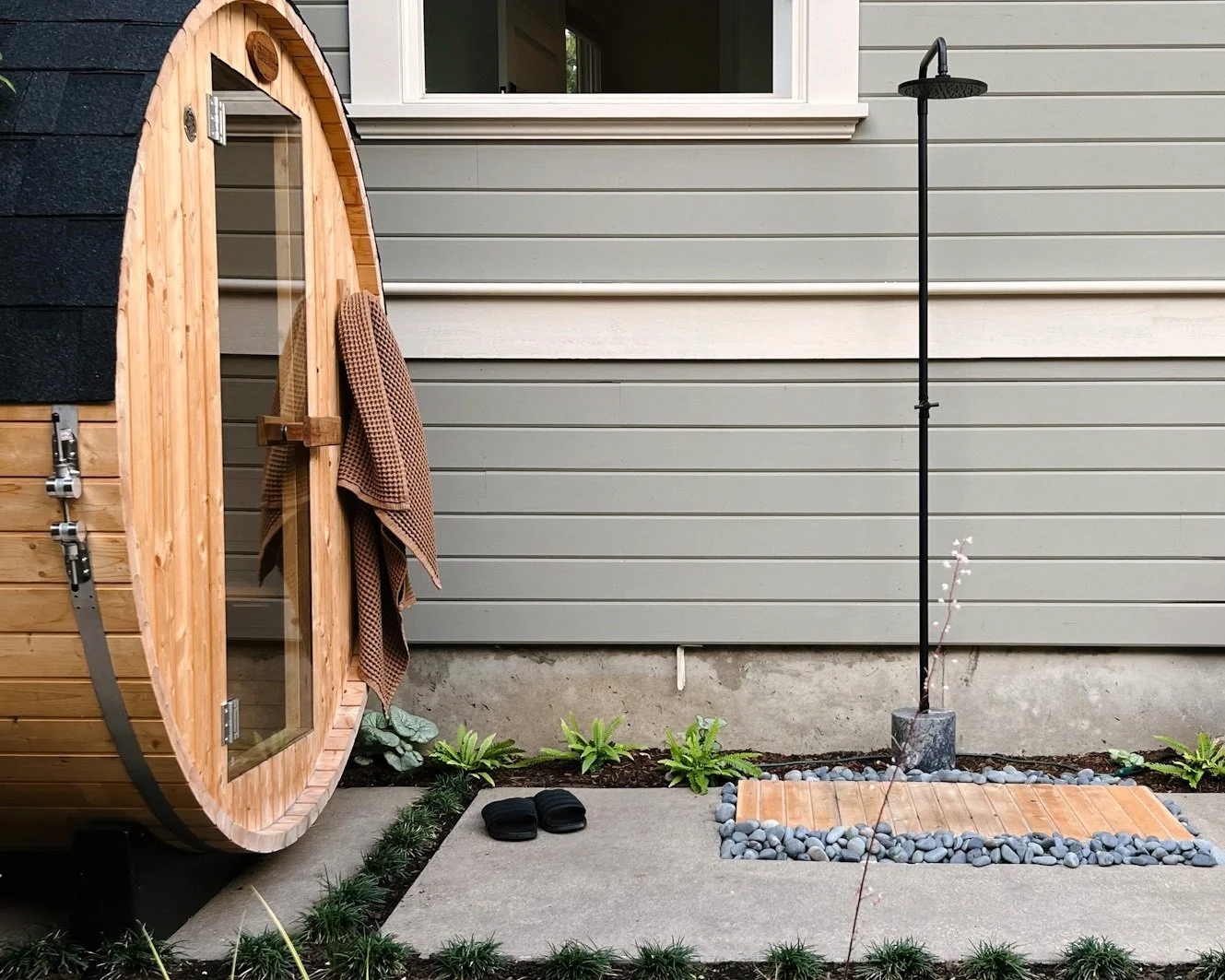 Nootka cedar sauna surrounded by native plantings, Blueprint Earth landscape design Portland