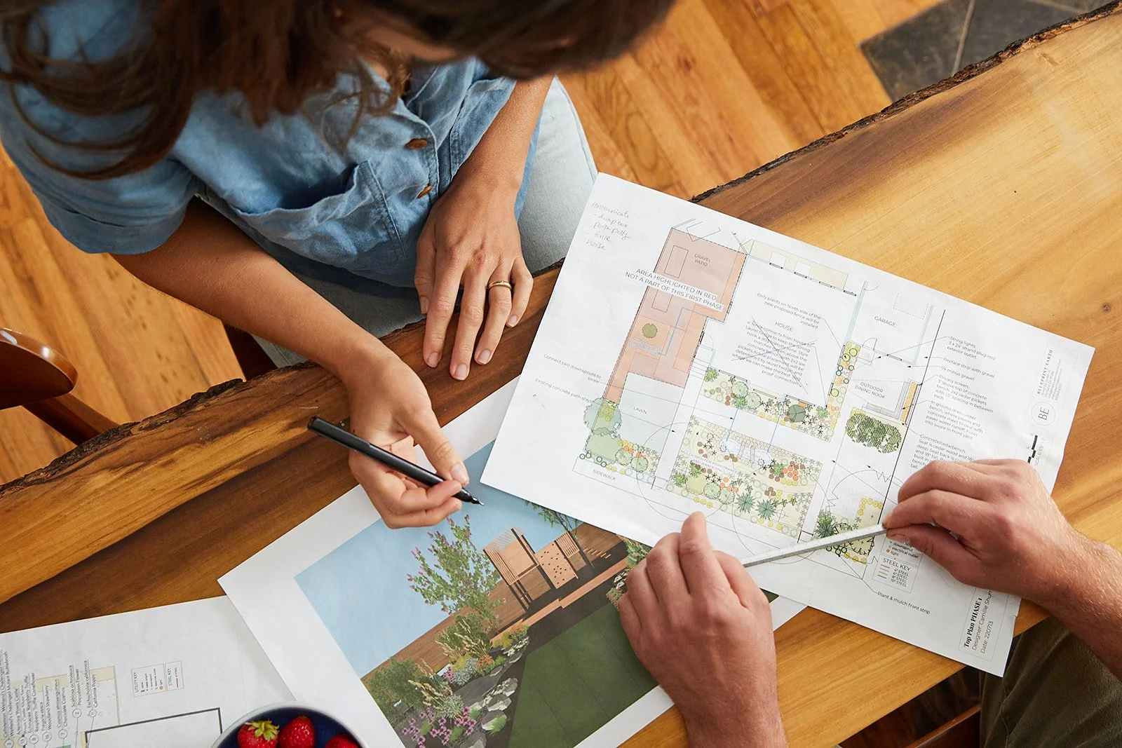 a designer and contractor reviewing design plans in portland, oregon