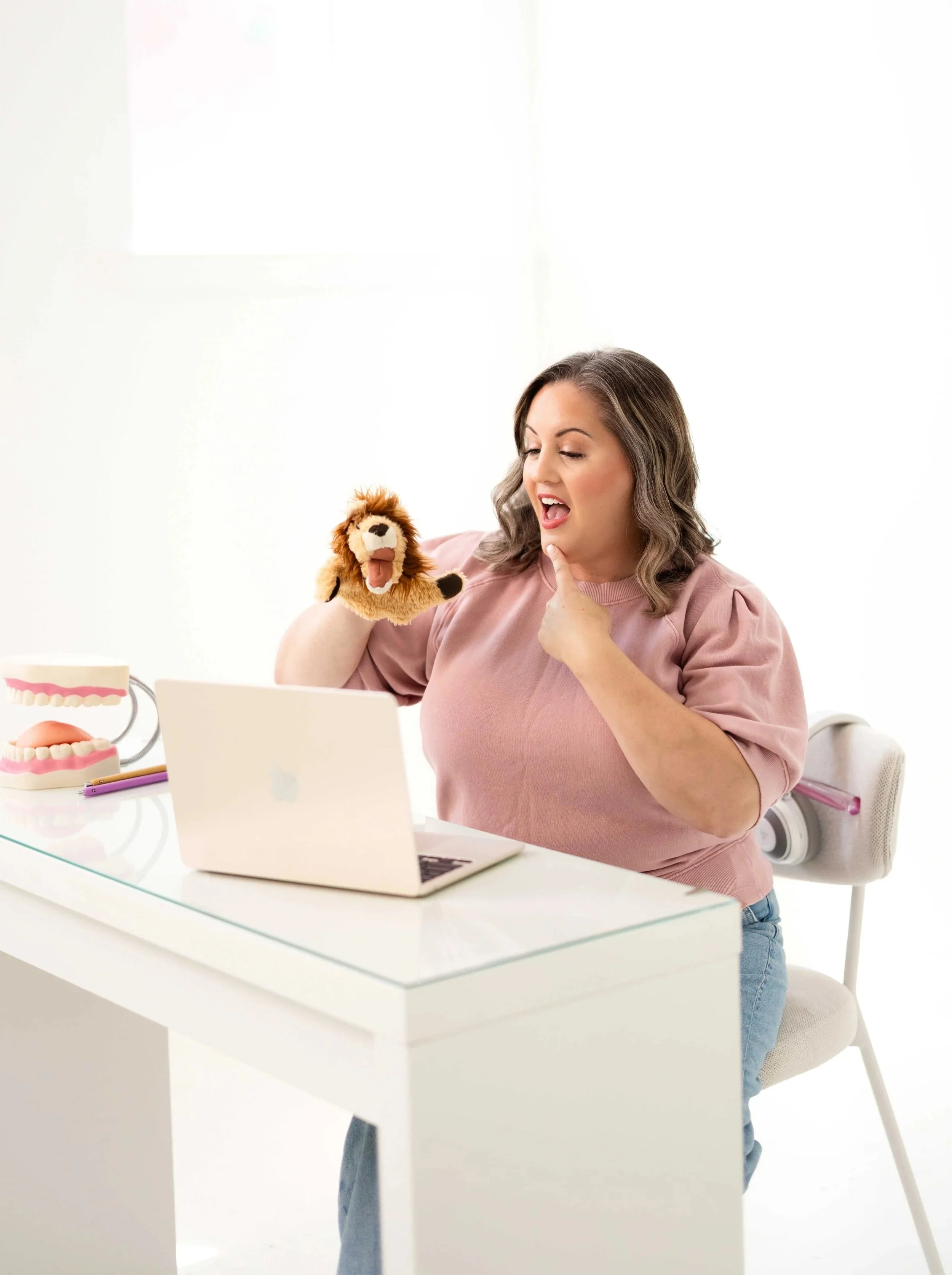 speech language pathologist providing virtual therapy with a puppet