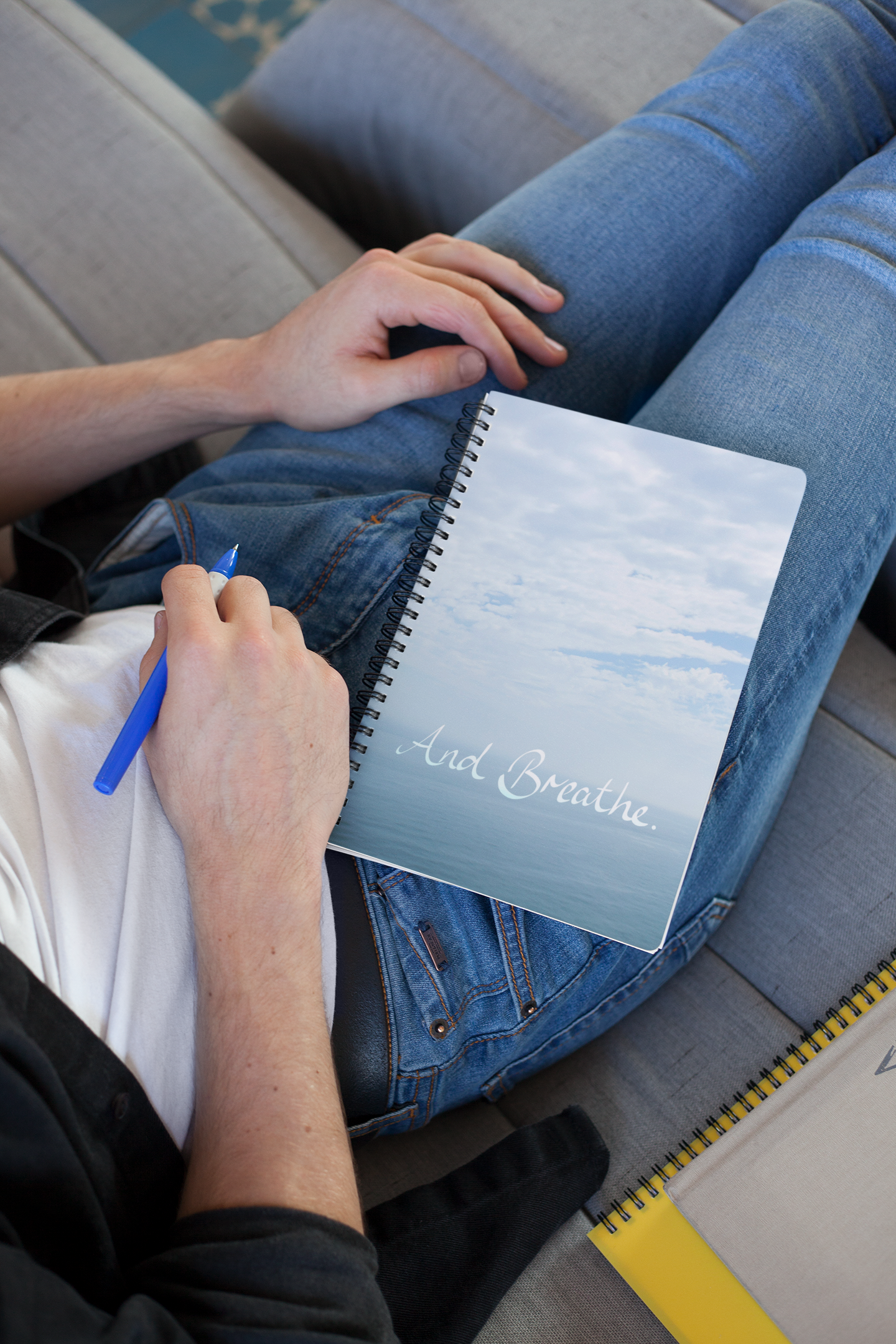 mockup-of-a-young-man-writing-in-his-school-s-notebook-24177.png