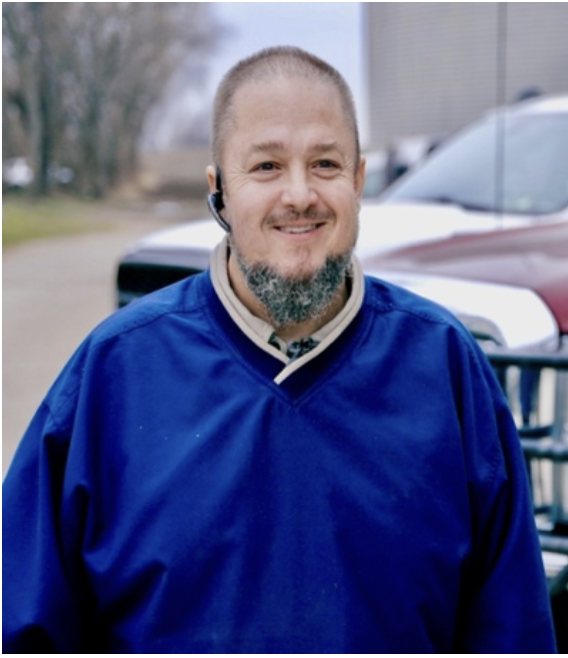 Farmer smiling at the camera