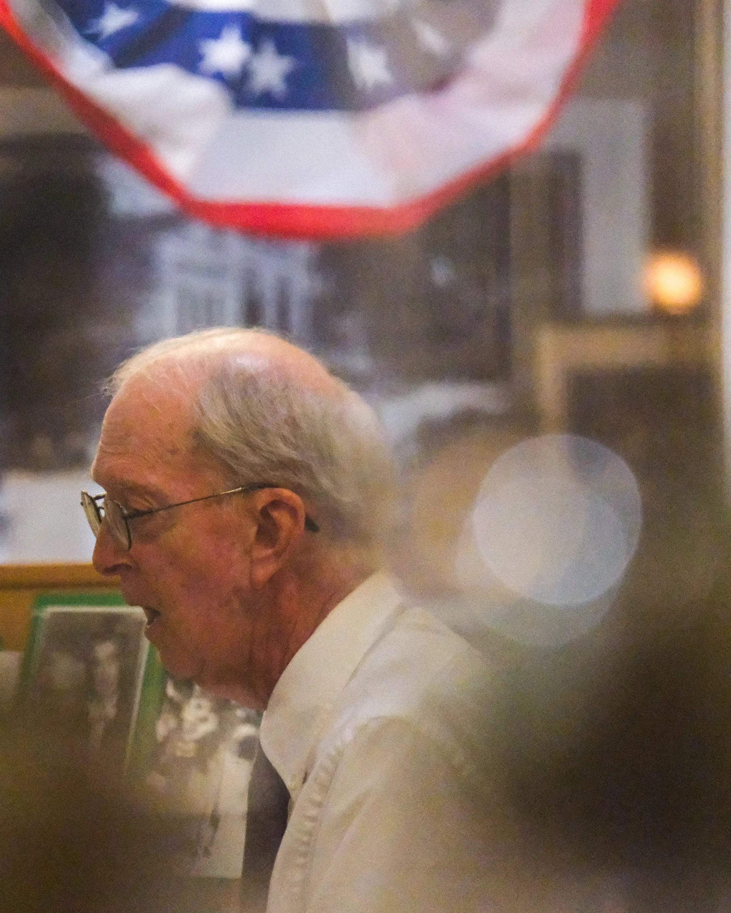 A close profile shot of Stan O'Neal performing as local history figure and former FBI agent Harold Parsons.