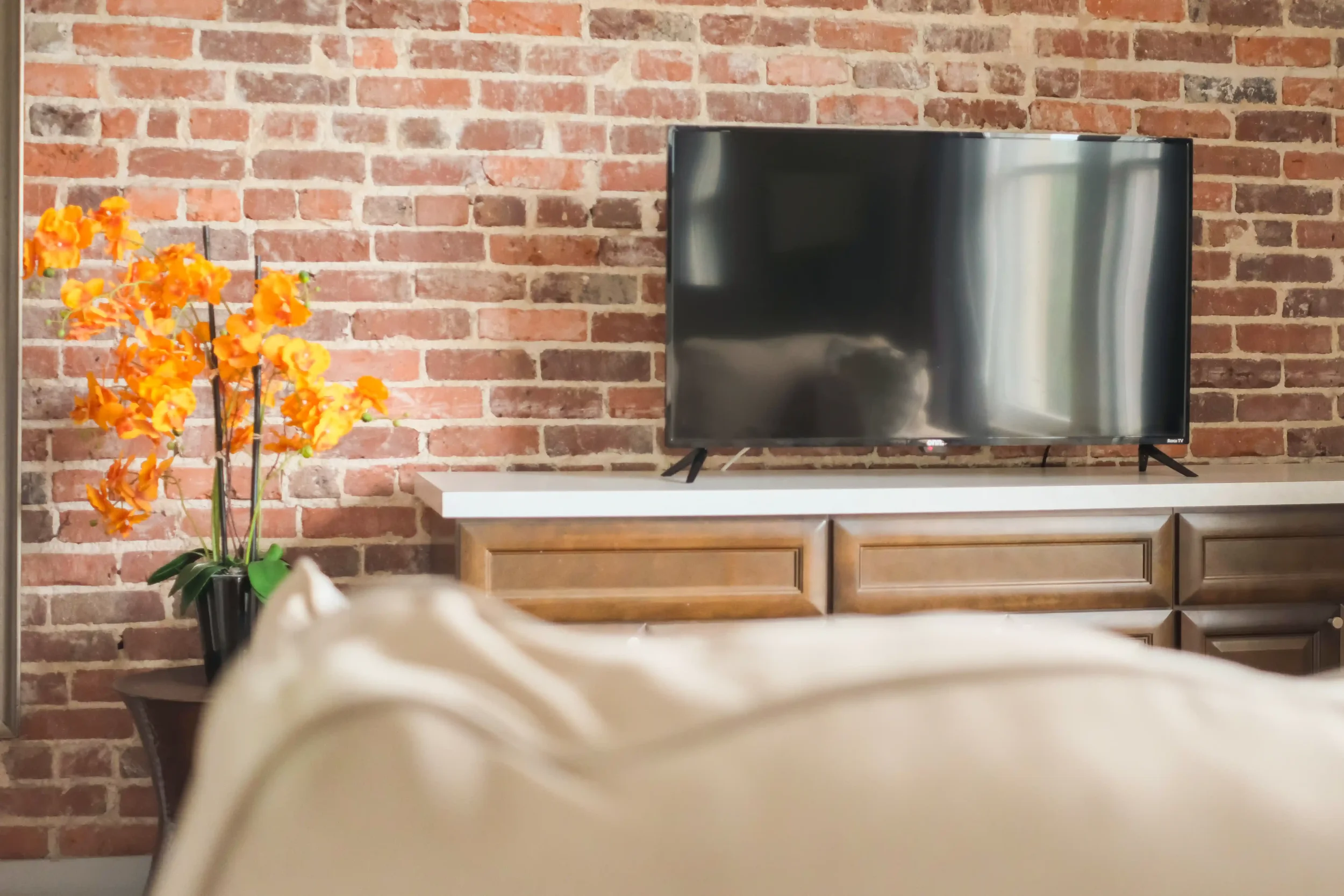  Clean modern lines and rich wooden consoles blend seamlessly against the original 1920s masonry of the boutique rooms. 