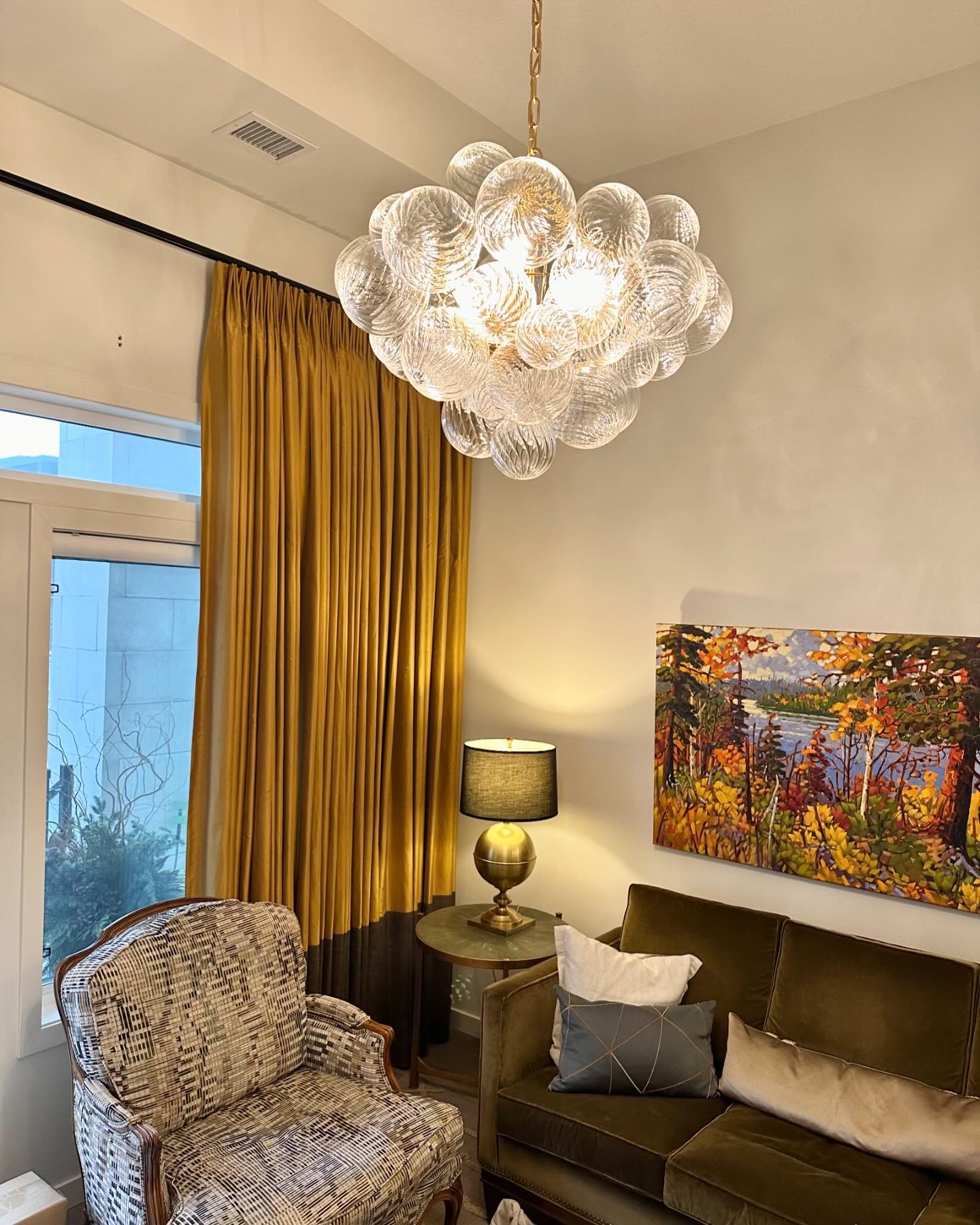 Transforming a builder basic condo into a timeless jewel box, utilizing as many of the homeowner&rsquo;s beloved existing pieces as possible. 

Here&rsquo;s how we did it: 
Relocating the existing fixture to the guest bedroom and replacing it with a 